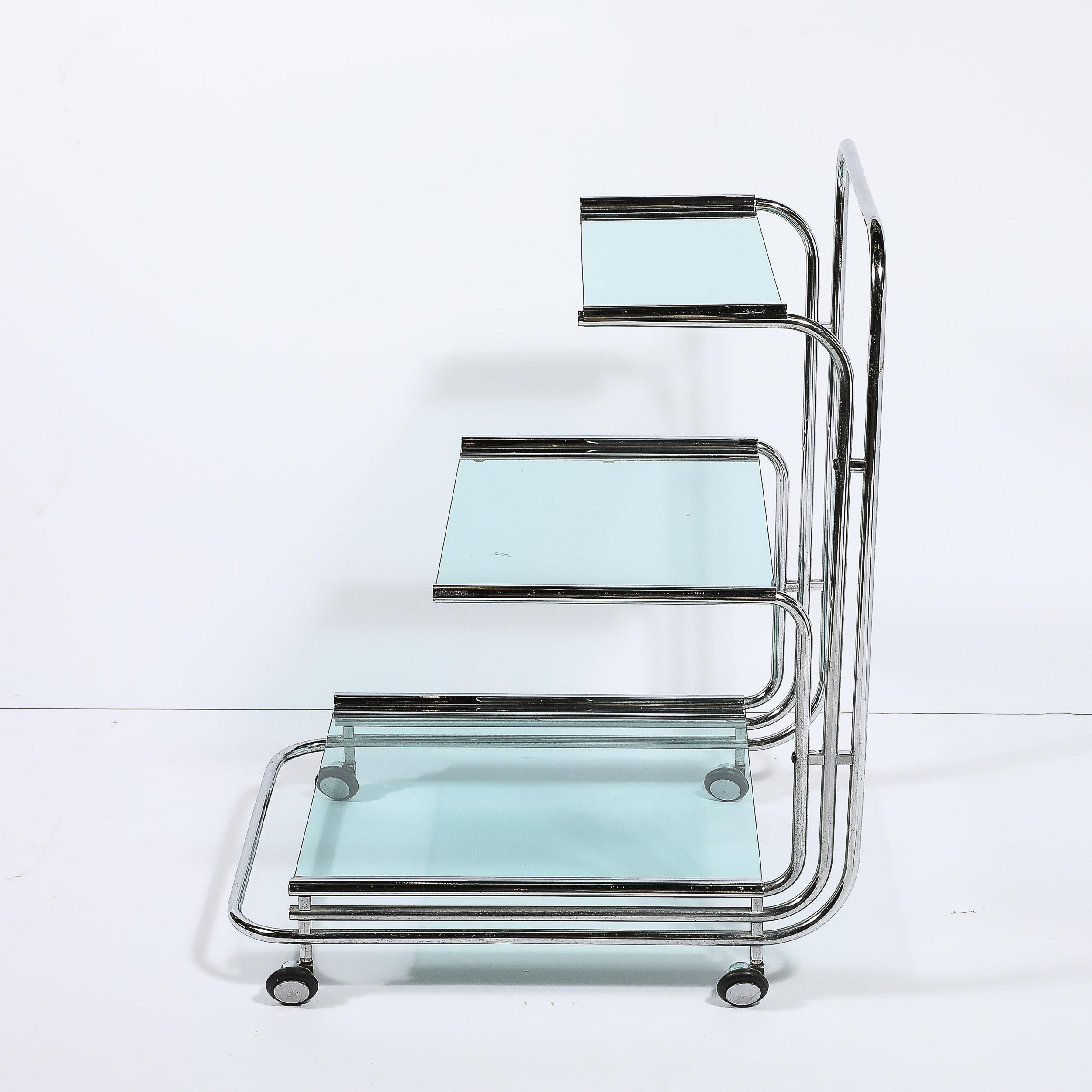 This well designed and proportioned Art Deco Streamline Three Tier Chrome and Glass Bar/Serving Cart with Removable Trays originates from the United States, Circa 1935. Features a streamline construction of tubular chrome elements that beautifully