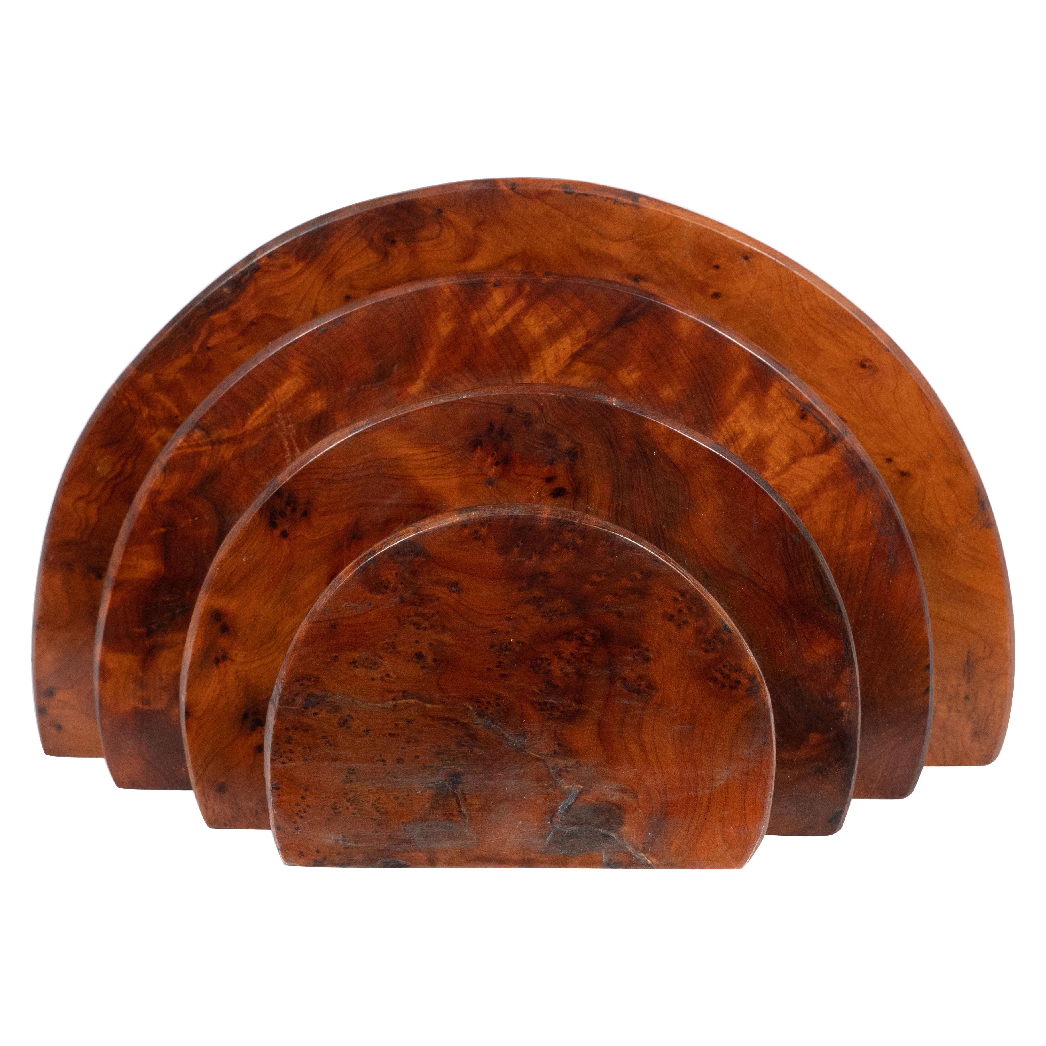 This elegant Art Deco Skyscraper style letter holder was realized in the United States, circa 1930. It features four concentric demilune streamlined forms that diminish in size from back to front. Realized in burled carpathian elm, the piece