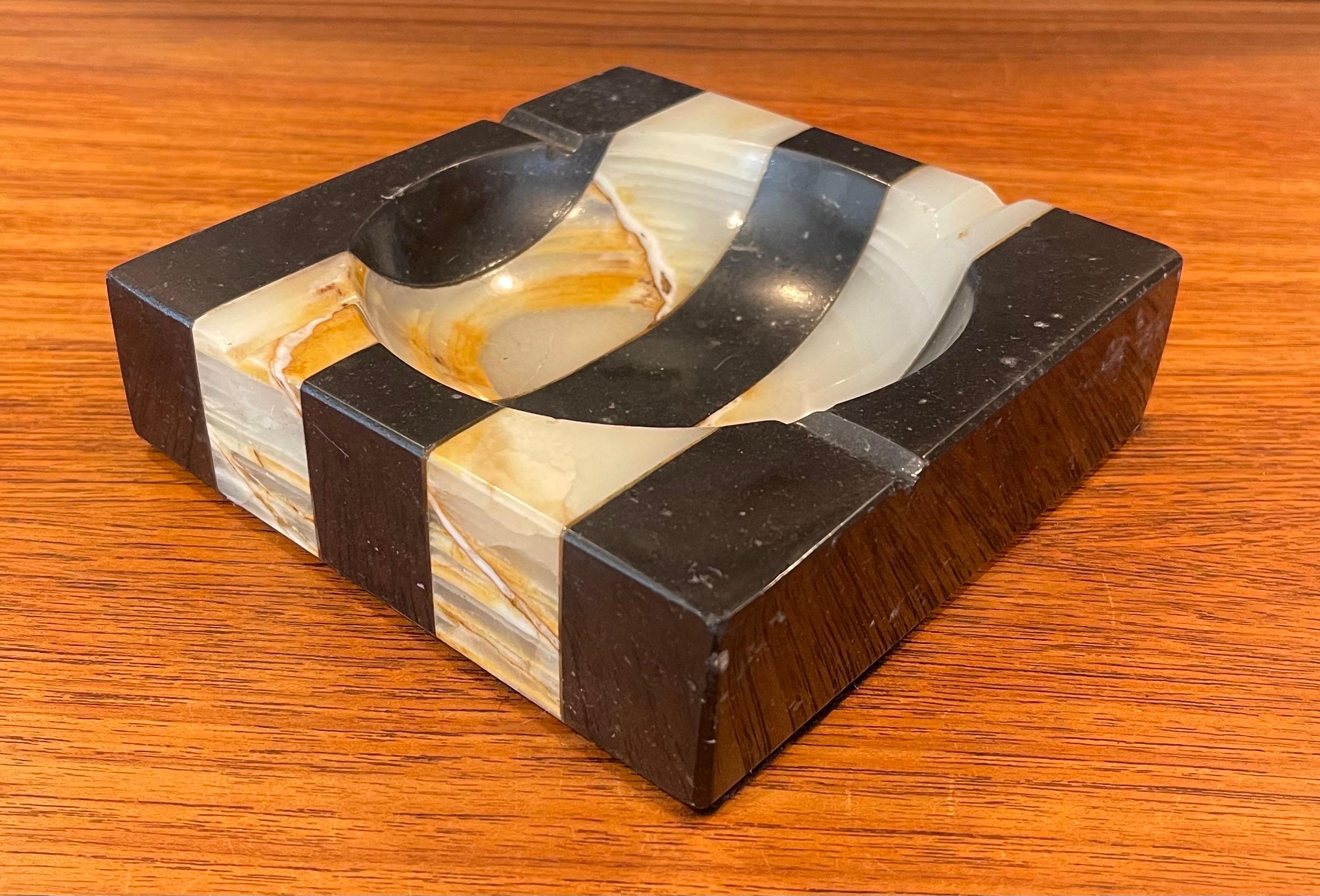 Art Deco striped marble ashtray circa 1940s. The piece is in good vintage condition (a couple of small ships on the edge-please see pictures) and has a wonderful original patina; it measures 6