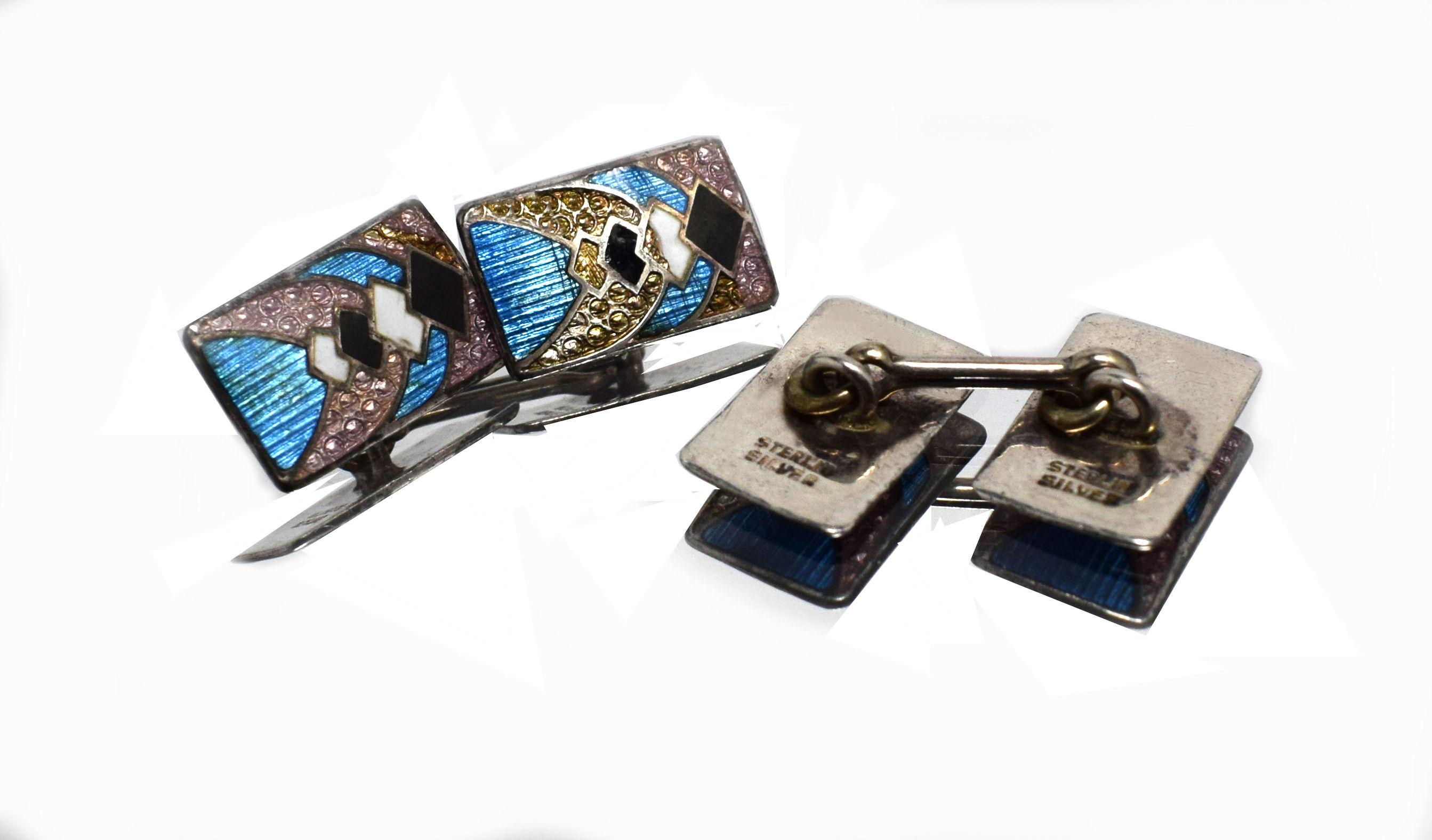 For your consideration are these rare and fabulously styled Art Deco geometric Guilloche enamel and sterling silver cufflinks. English made double cufflinks which feature the most dramatic geometric Art Deco design in black, white, lilac and