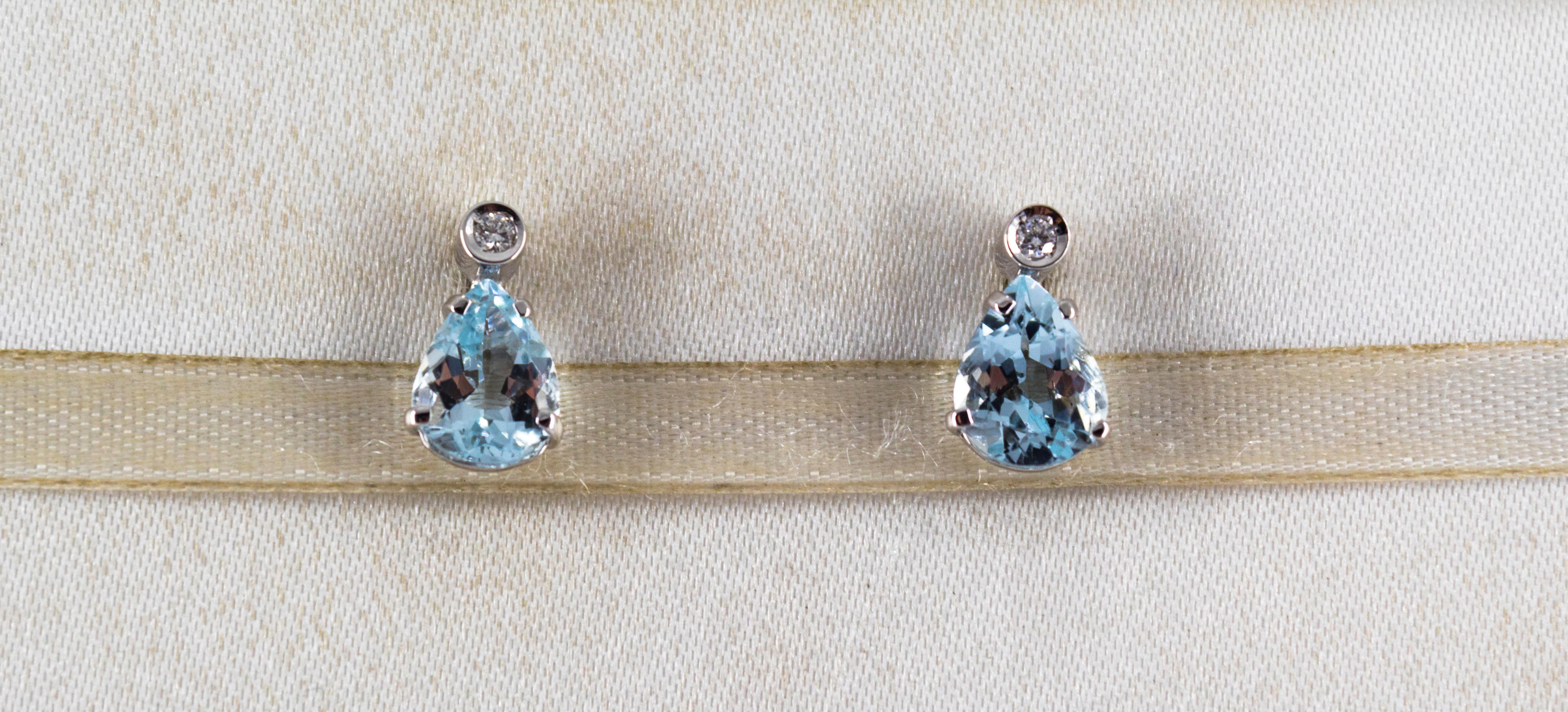 These Earrings are made of 18K White Gold.
These Earrings have 0.06 Carats of White Brilliant Cut Diamonds.
These Earrings have 2.40 Carats of Aquamarine.

These Earrings are inspired by Art Deco.

All our Earrings have pins for pierced ears but we