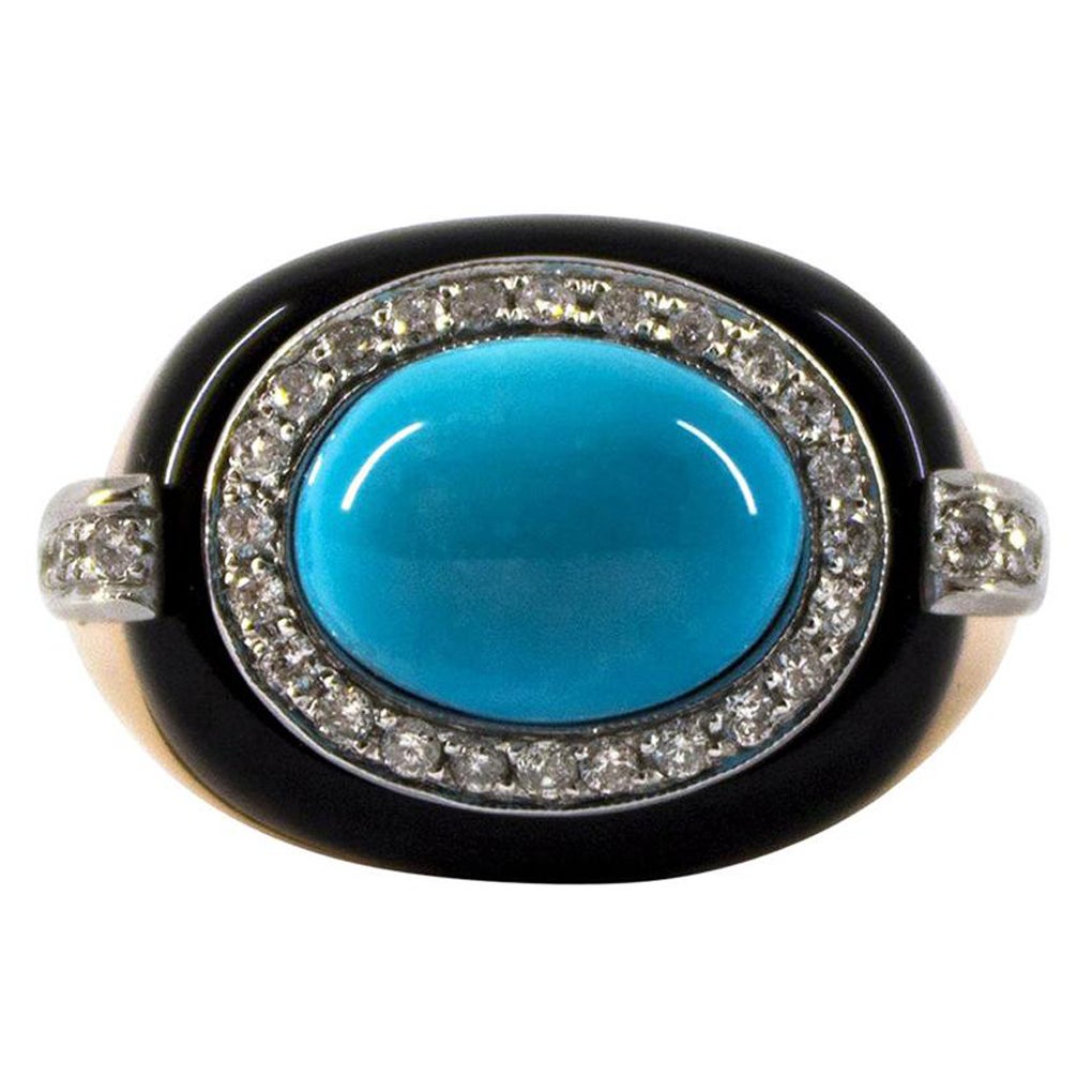 This Ring is made of 14K Yellow Gold.
This Ring has 0.40 Carats of White Modern Round Cut Diamonds.
This Ring has Turquoise and Onyx.
This Ring is inspired by Art Deco and it is available also with a central Mediterranean (Sardinia, Italy) Red