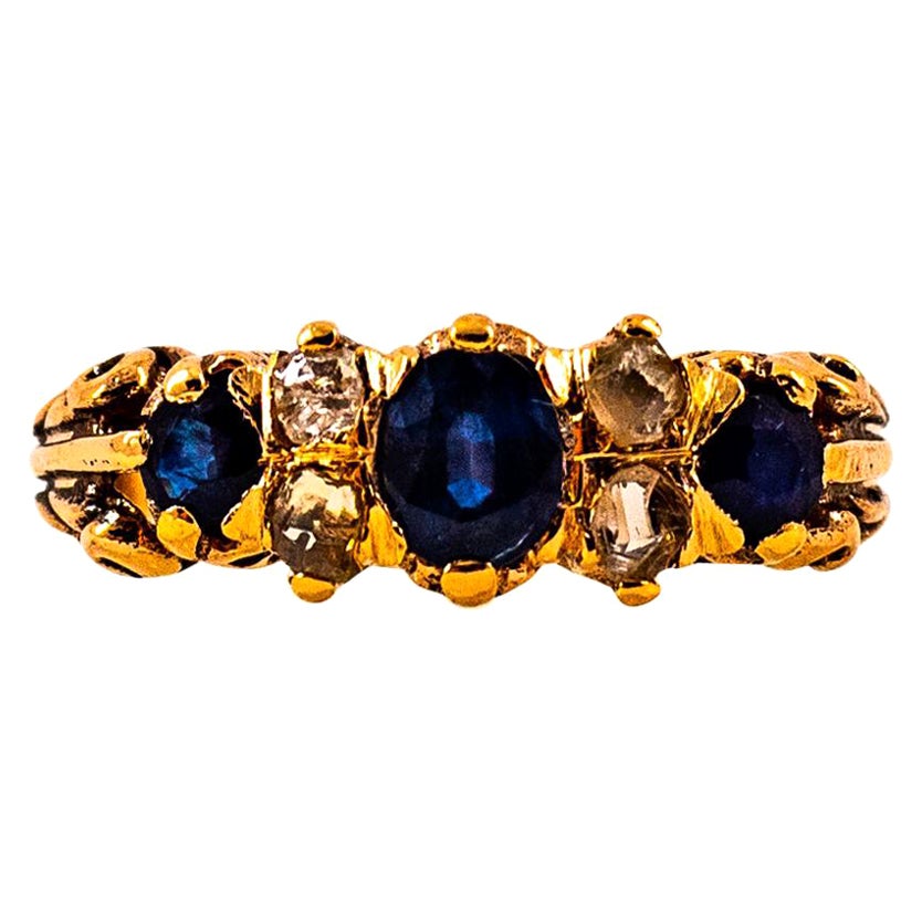 Anillo de oro amarillo con diamante blanco talla rosa de 0,75 quilates y zafiro azul, estilo art déco en venta