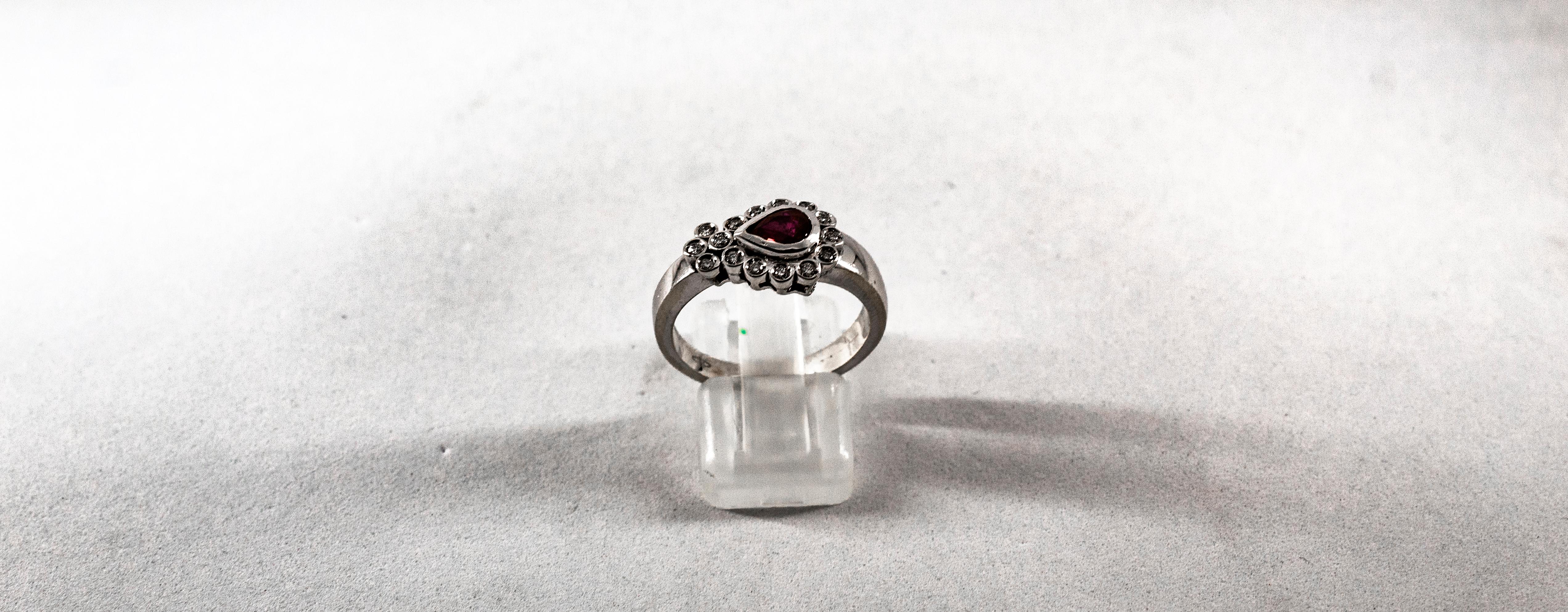 This Ring is made of 18K White Gold.
This Ring has 0.28 Carats of White Modern Round Cut Diamonds.
This Ring has a 0.60 Carats Pear Cut Ruby.
Size ITA: 17 USA: 8

We're a workshop so every piece is handmade, customizable and resizable.