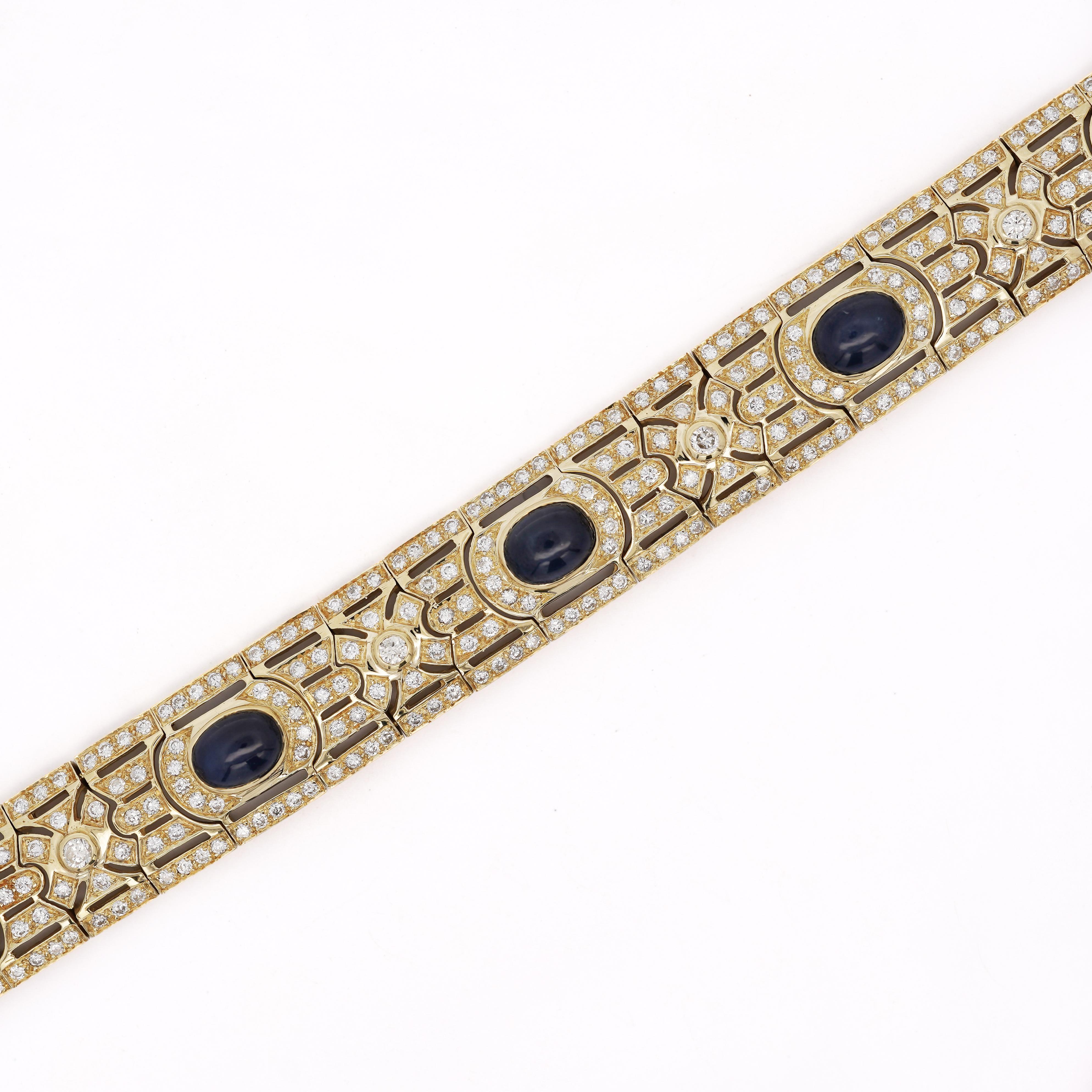 Art Deco style bracelet featuring six natural cabochon cut sapphires totaling approximately 12 carats and 5 carats of natural diamonds set in intricate 18K yellow gold geometric links. Measures 13.7mm width and 7.25 inches length, weighing 39.59