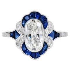 Bague en platine de style Art déco, sertie d'un diamant ovale de 1,23 carat et de saphirs