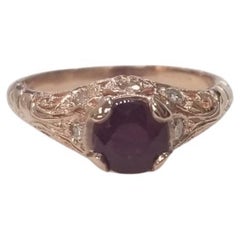 Ring aus 14 Karat Roségold mit Rubin und Diamant im Art-déco-Stil