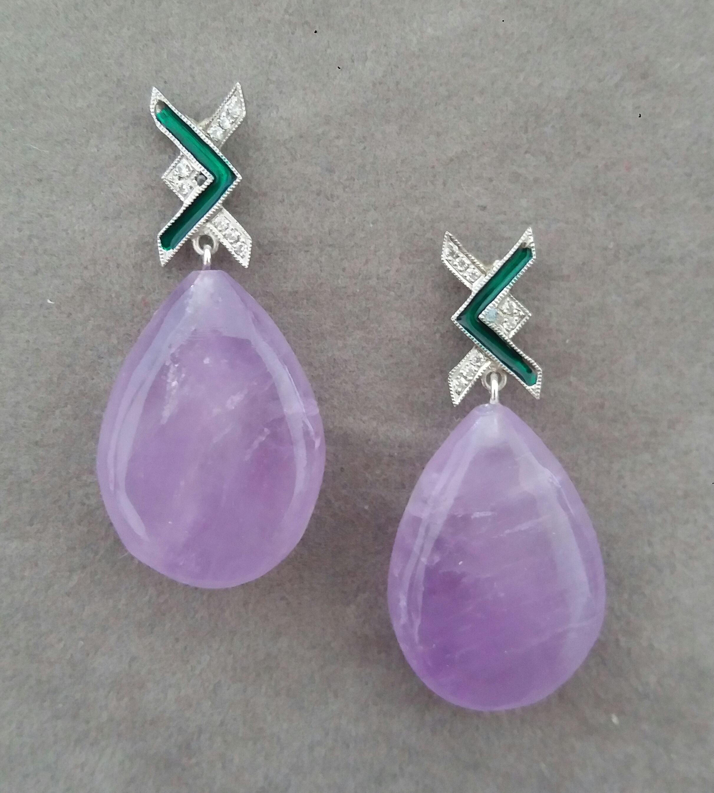In these Art Deco Style handmade earrings 2 very good quality Natural Amethyst plain drops measuring 18 x  26 mm. are suspended from 2 white 14 kt gold tops  with 16 full cut round diamonds and Green Enamels.

In 1978 our workshop started in Italy