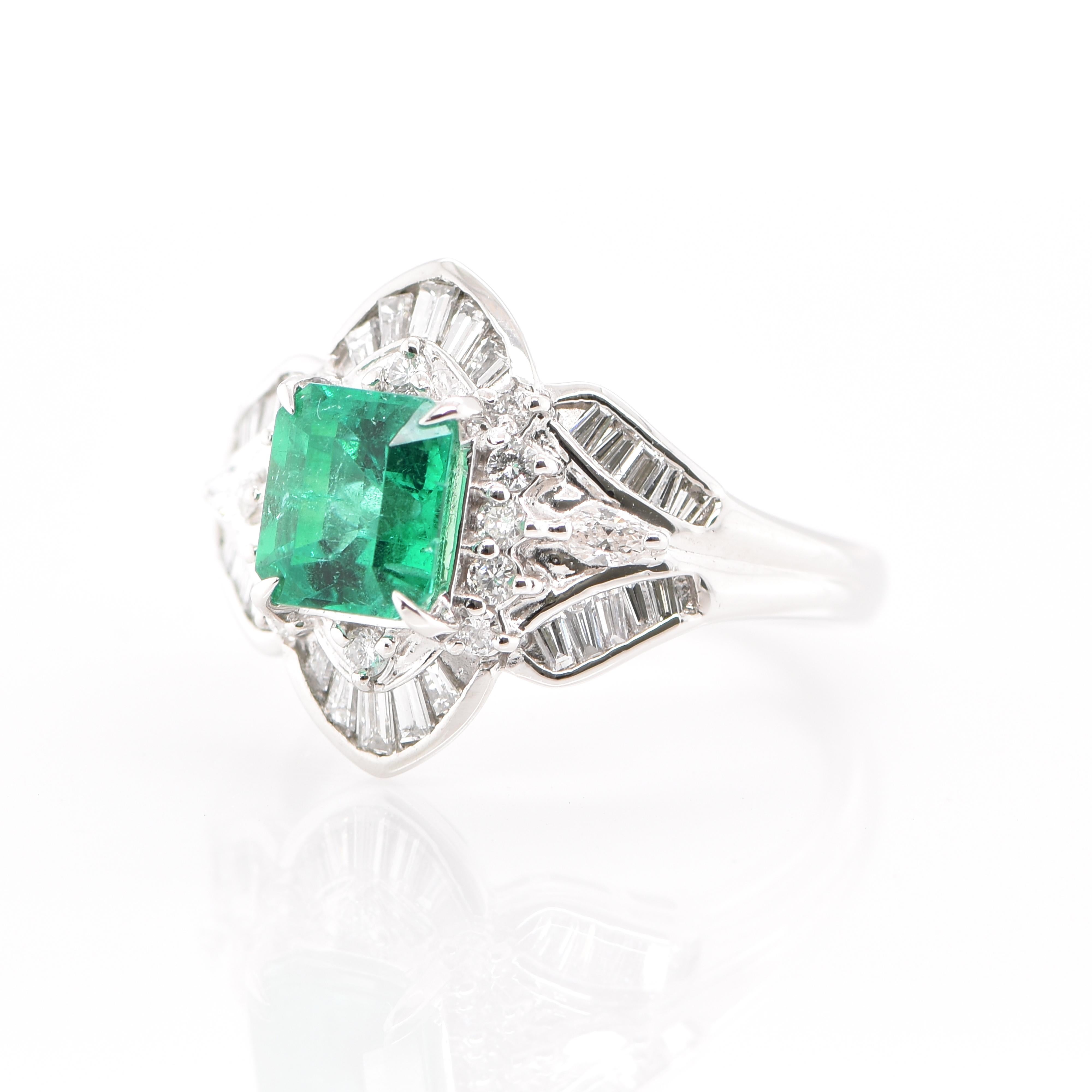 A stunning Art Deco Styled Cocktail Ring featuring a 1.44 Carat Emerald and 0.68 Carats of Diamond Accents set in Platinum. People have admired emerald’s green for thousands of years. Emeralds have always been associated with the lushest landscapes