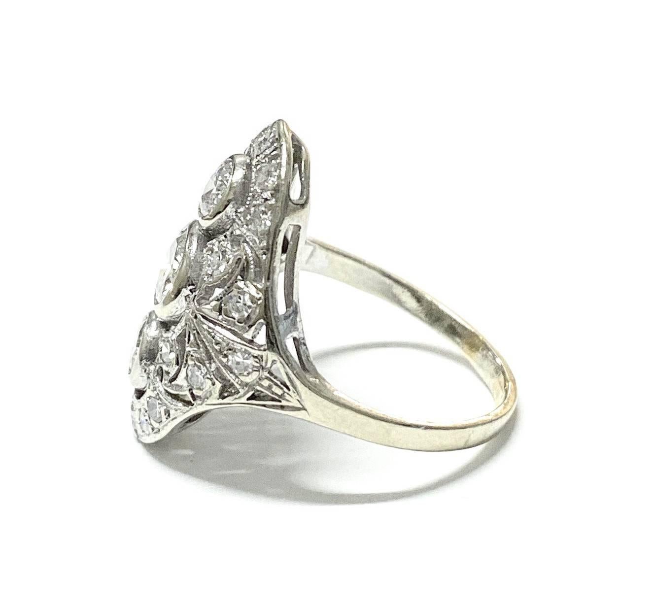 For sale we have a Navette style Art Deco Cocktail Ring. This ring contains 1.25 CTW of single cut Diamonds set in 14K White Gold Filigree. This piece is currently a finger size 7.25 but we do offer sizing upon request (fees may apply). This ring is