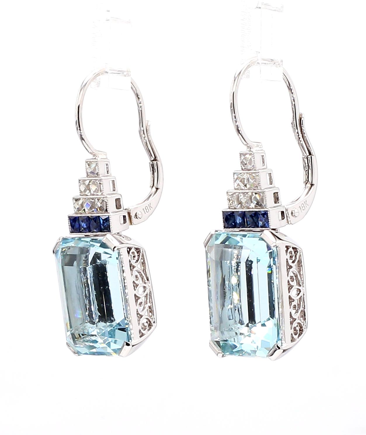 Captivating and bold, the Art Deco Style Aquamarine Earring commands attention.

*Two baby blue emerald-cut aquamarines totaling 17.38 carats
*Accented by 0.48 carats of calibrated-cut sapphires and 0.80 carats of VS, G-color diamonds
*Set in