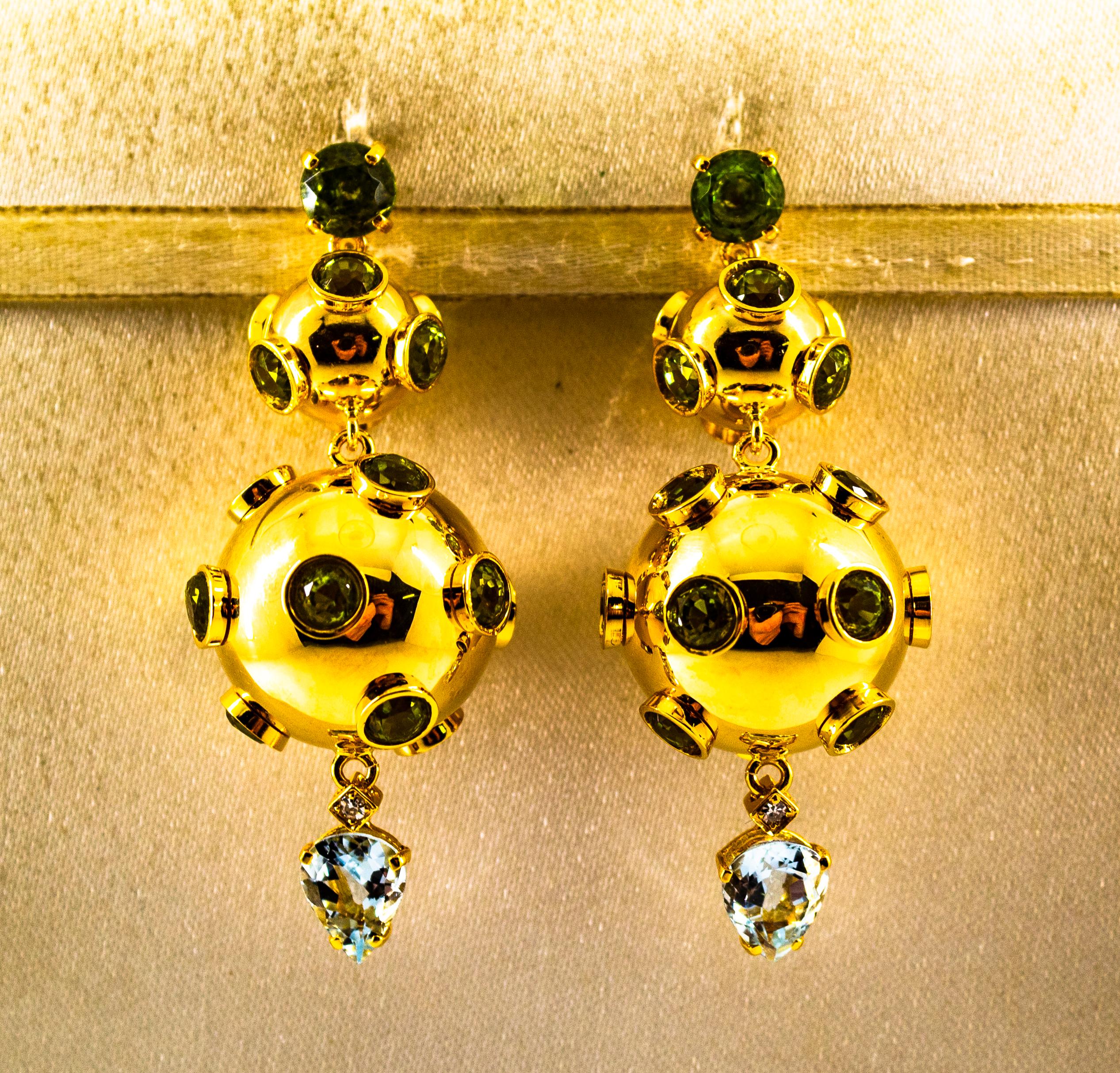 These Earrings are made of 9K Yellow Gold.
These Earrings have 0.05 Carats of White Brilliant Cut Diamonds.
These Earrings have 2.80 Carats of Aquamarines.
These Earrings have 14.80 Carats of Peridots.

These Earrings are inspired by Art