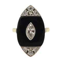 Art Deco Style 18 Karat Gold and Platinum Black Onyx and Diamond Navette Ring