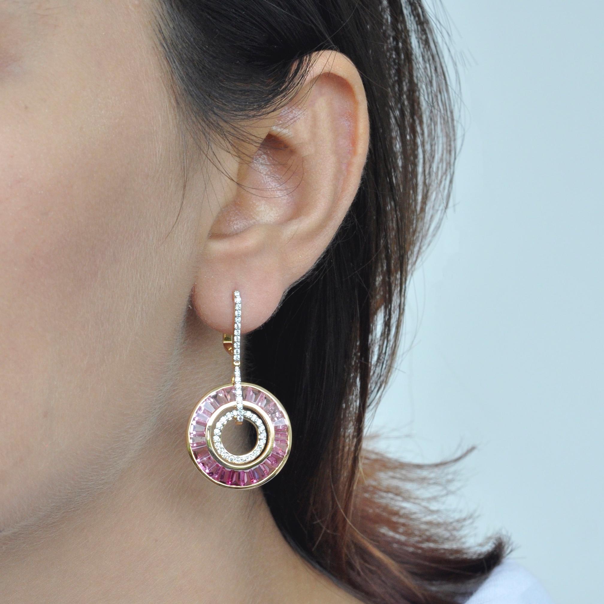 Art deco style, color and culture all come together to inspire this delicate 18 karat gold pink tourmaline baguette diamond dangle art deco pair of circle earrings, where dégradé (gradient) hues of pink tourmaline exudes feminism while dictating the