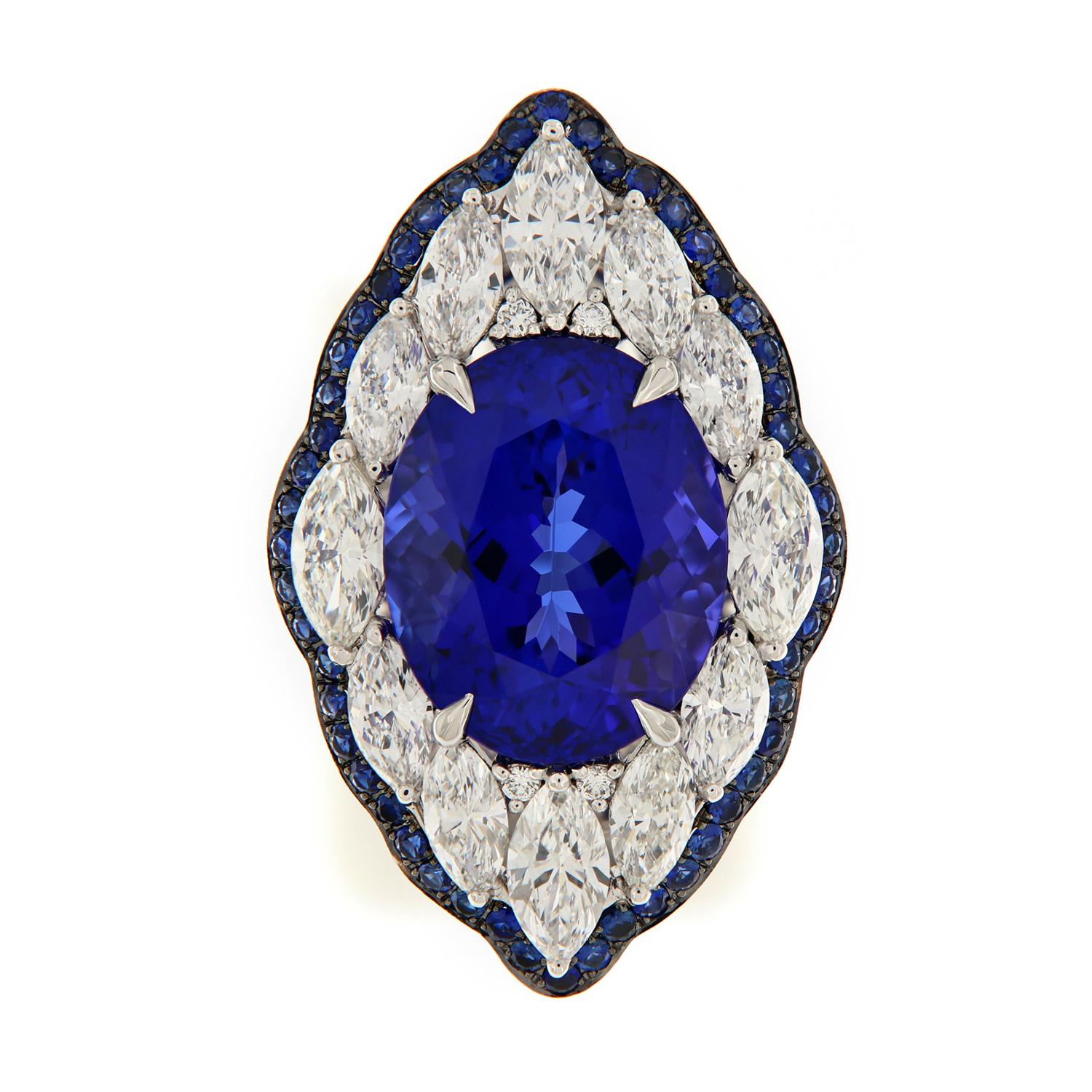This stunning Tanzanite is the color that ALL other Tanzanites are judged by! It's perfectly complimented in this Art Deco styled ring with sapphire accents & VS, F-G marquise cut diamonds = 2.78 Cttw. Every part of this ring is detailed, even the