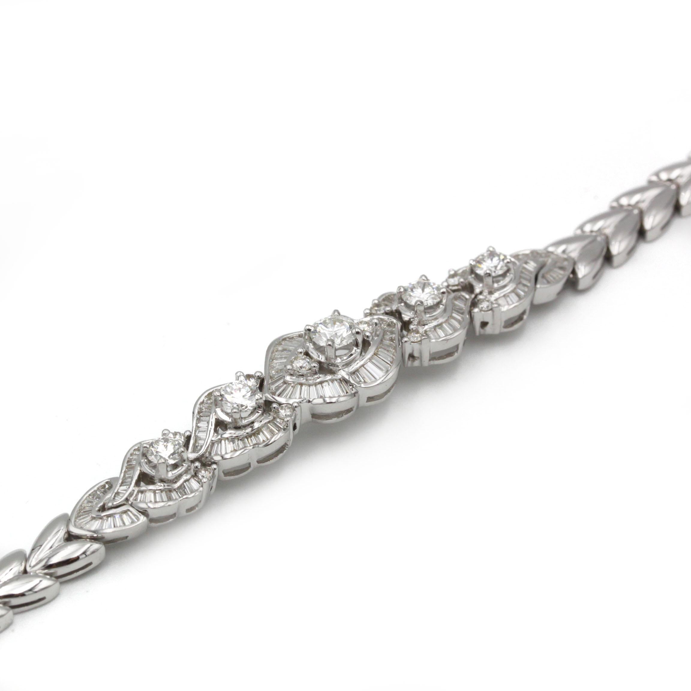 This exquisite Art Déco–inspired bracelet is crafted in luminous 18K (750‰) white gold and set throughout with approximately 3 carats of hand-selected diamonds. Each ornate link features a round brilliant-cut diamond at its center, framed by a halo