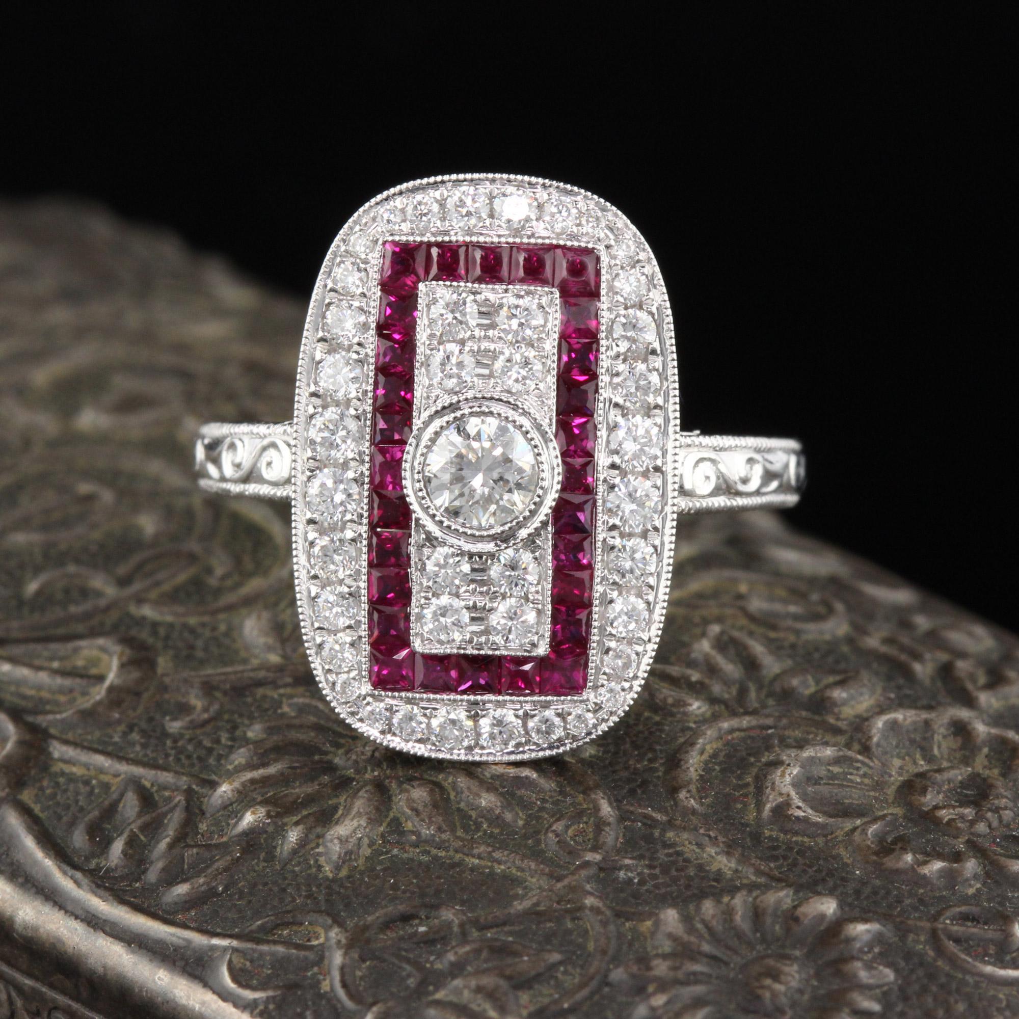 Beautiful Art Deco style ring in 18K White Gold with diamonds and channel set natural rubies! This ring is hand engraved and mil-grained.

Item #R0057

Metal: 18K White Gold

Center Diamond Weight: 0.25 cts 

Total Diamond Weight: 0.76 cts

Diamond