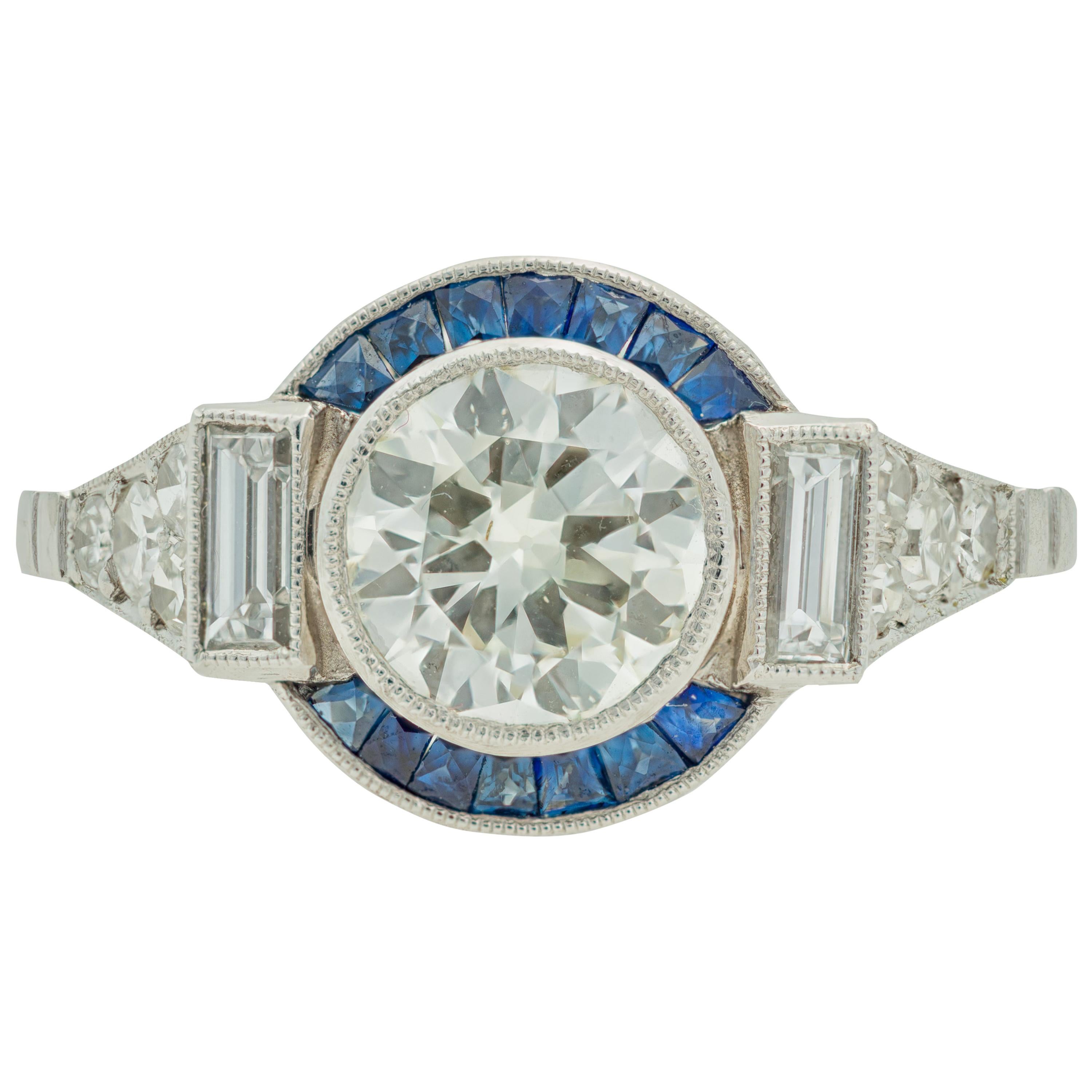 Art Deco Style 1960s 1.11 Carat Diamond Ring with Sapphire Halo in Platinum