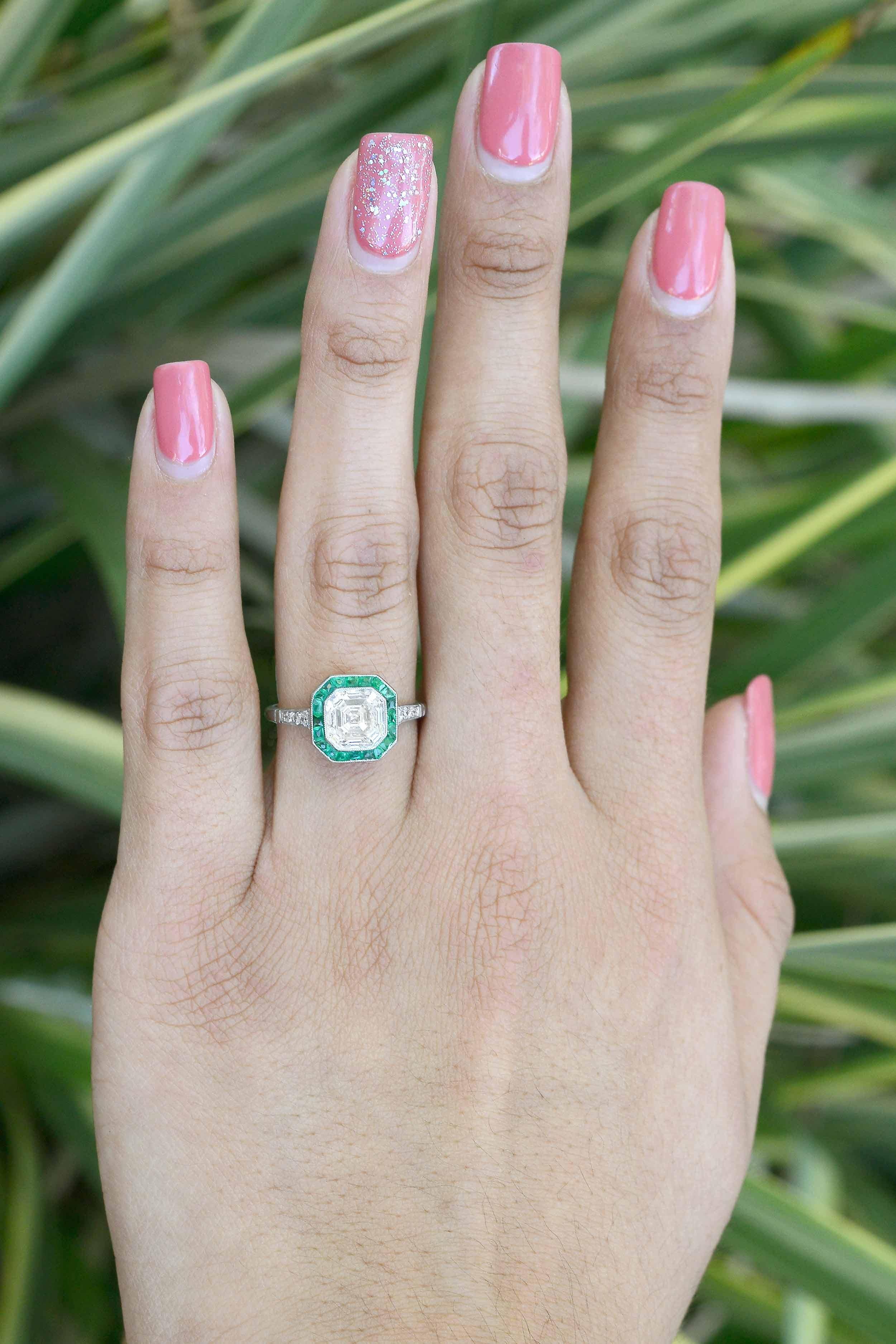 The Charlotte asscher cut diamond engagement ring is centered by a fiery 2 carat square sparkler. Set off by a French cut emerald halo and faithfully rendered by hand in an Art Deco style octagon platinum bezel.

You'll love the ease of wearing the