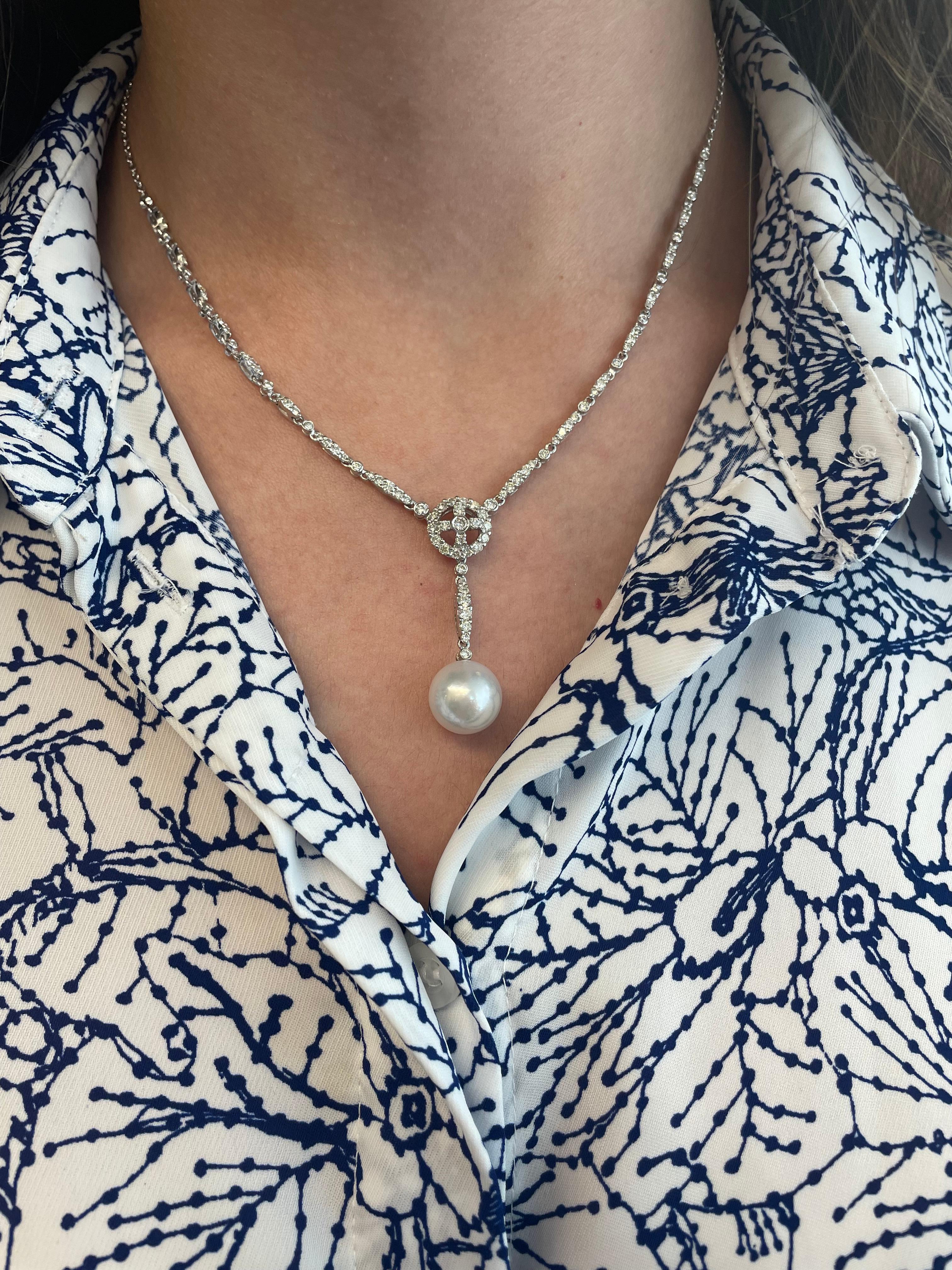 Art Deco inspired diamond and pearl drop necklace.
101 round diamonds, 2.12 carats. Approximately H/I color and SI clarity. 18-karat white gold.
Accommodated with an up to date appraisal by a GIA G.G. upon request. please contact us with any