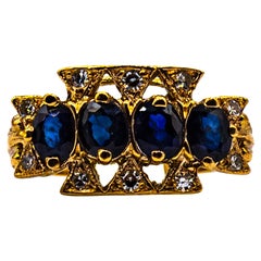 Anello in oro giallo con diamante bianco e zaffiro blu taglio ovale da 2,20 carati in stile Art Deco