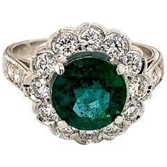 Anello con smeraldo rotondo e diamante a raggiera in stile Art Deco da 2,47 carati in oro bianco 18 carati
