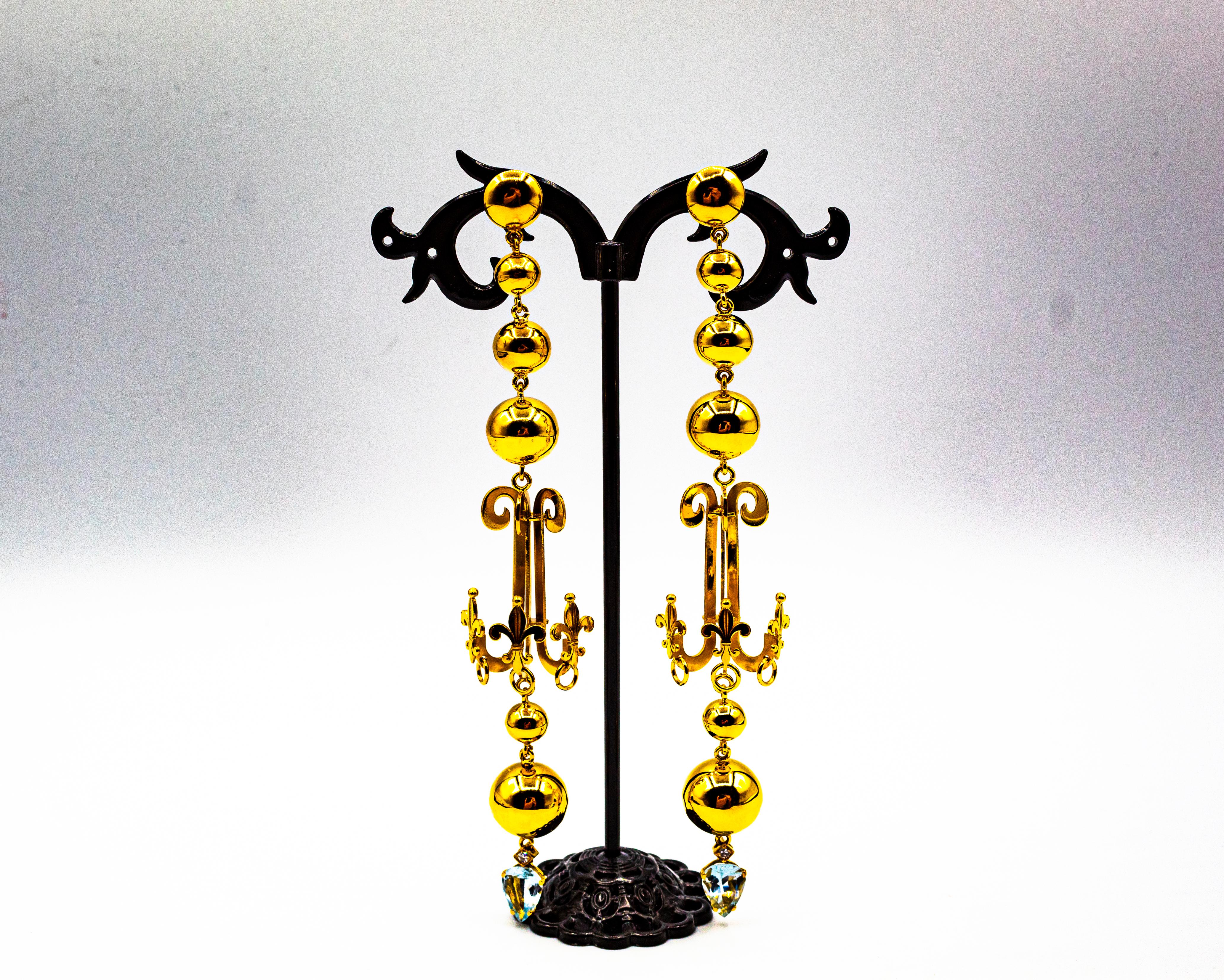 These Earrings are made of 9K Yellow Gold.
These Earrings have 0.10 Carats of White Brilliant Cut Diamonds.
These Earrings have 2.80 Carats of Aquamarines.
These Earrings are inspired by Art Deco.

All our Earrings have pins for pierced ears but we