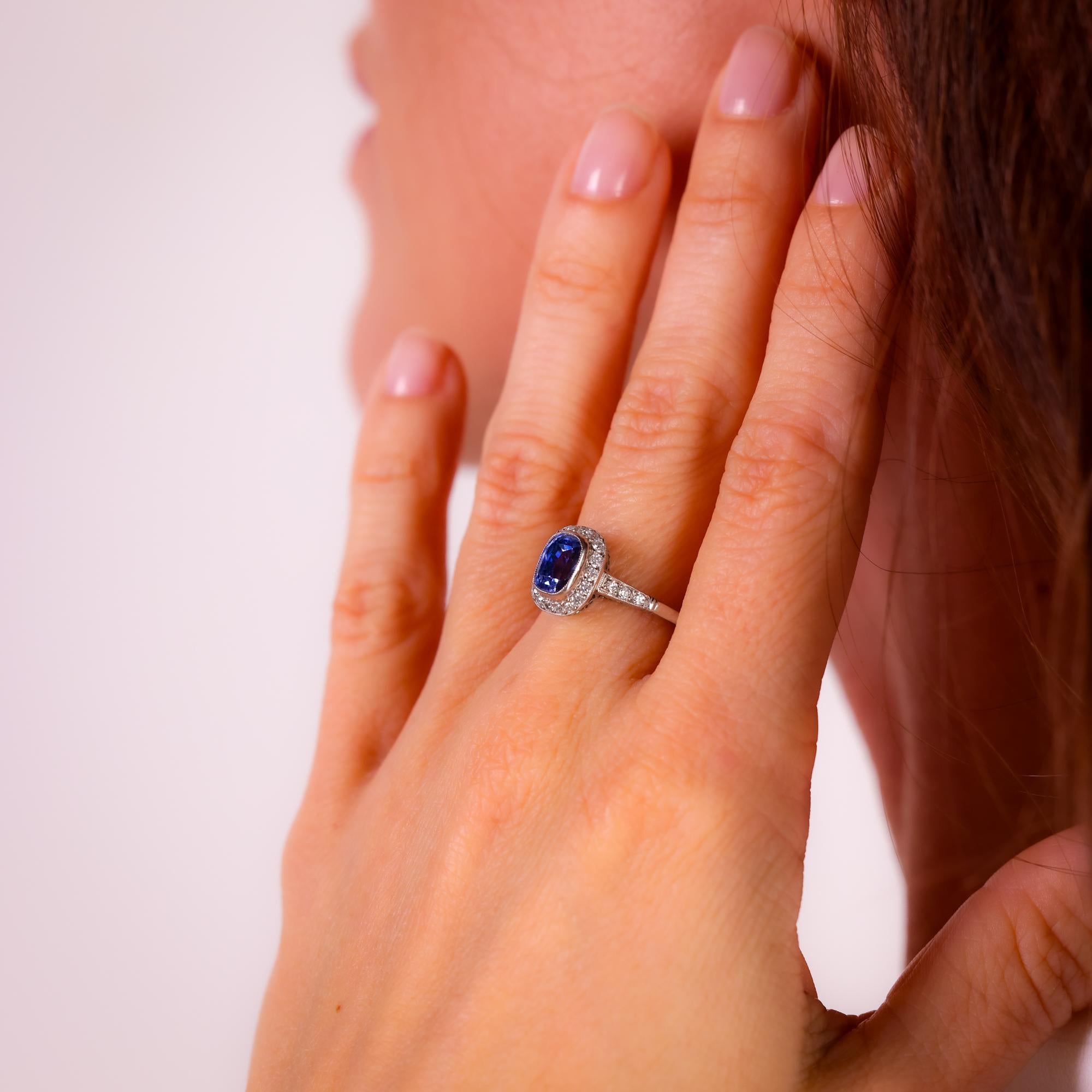 This modern Art Deco-inspired platinum ring showcases a striking 2.91 carat sapphire, framed by dazzling old European cut diamonds for timeless elegance and sophistication.

Center stone: Rectangular cushion cut blue sapphire
Weight: 2.91