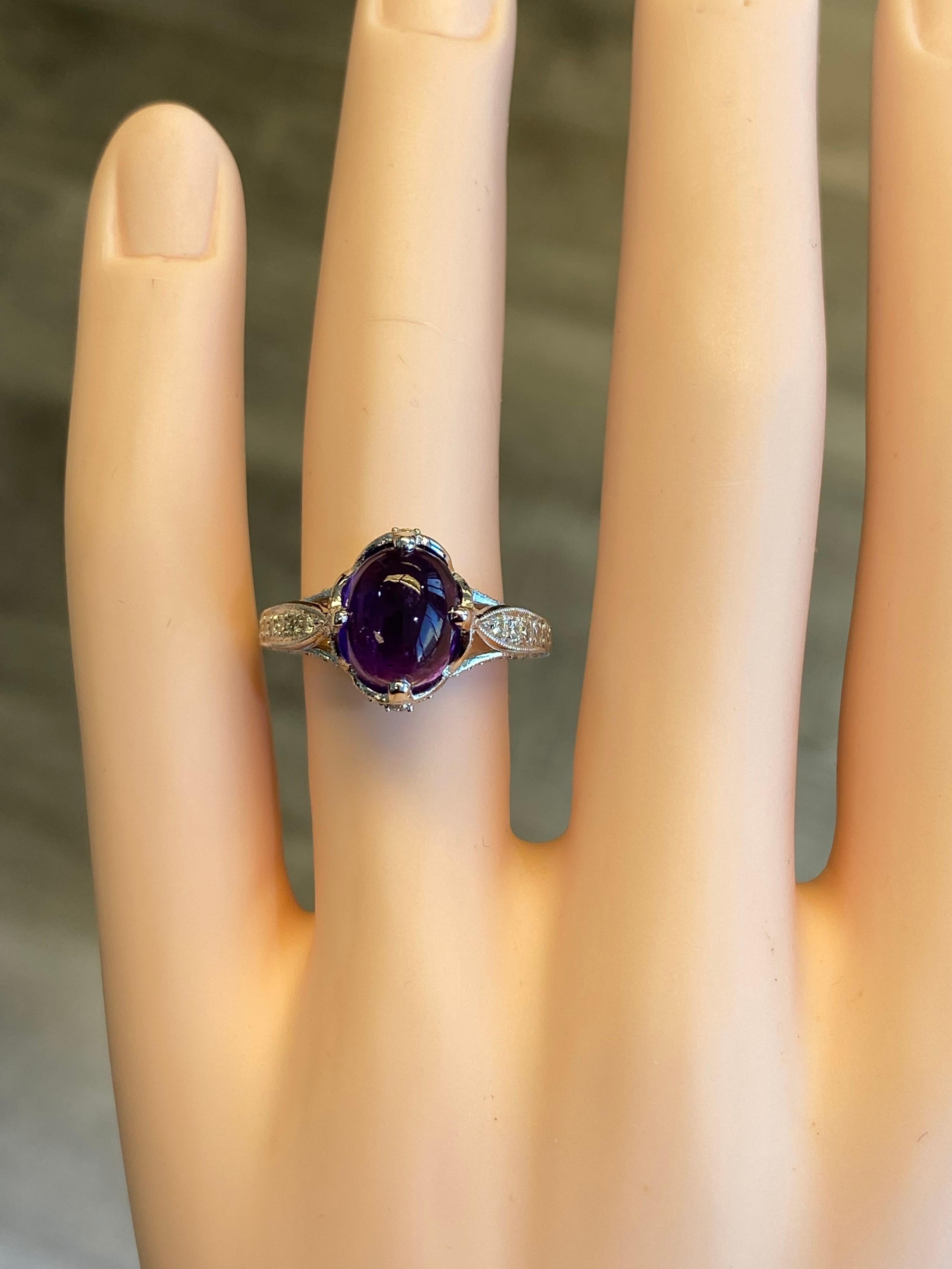 Statement amethyst and diamond ring. 
3.00ct cabochon amethyst surrounded by 0.61ct of round cut diamonds. 3.61ct total gemstone weight set in 18-karat white gold with milgrain work. 
Accommodated with an up to date appraisal by a GIA G.G., please