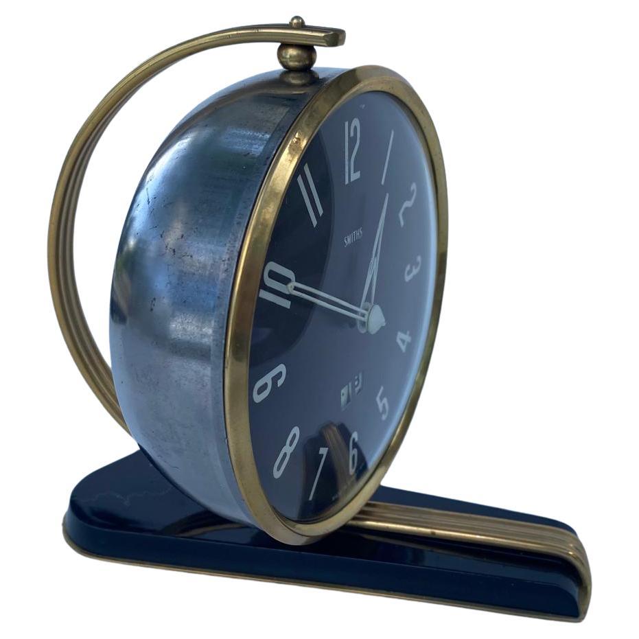 In the 1960's Smiths produced a range of high end 30 hr manual clocks with a distinctly Art Deco feel to them. This handsome chap is a surviving example, in great condition. The number dial is chrome, as are the hands, feet & base. He is virtually