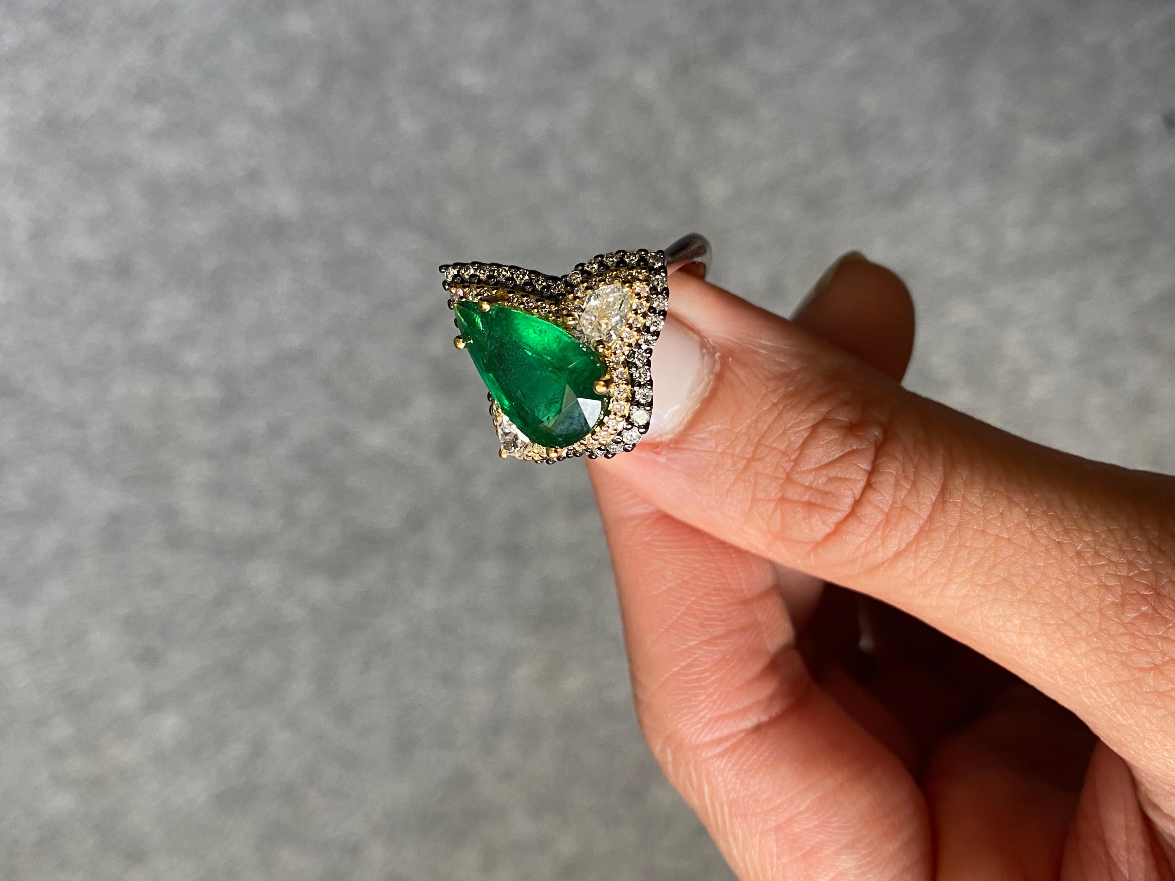 Art Deco Style 3.28 Ctw Fine Quality Zambian Emerald & Diamond Pear Shape French Pave Ring in 18k Two-Tone Gold

Add the influence of the Art Deco Era to your fine jewelry collection with this one-of-a-kind 18k gold ring, reimagined for the modern