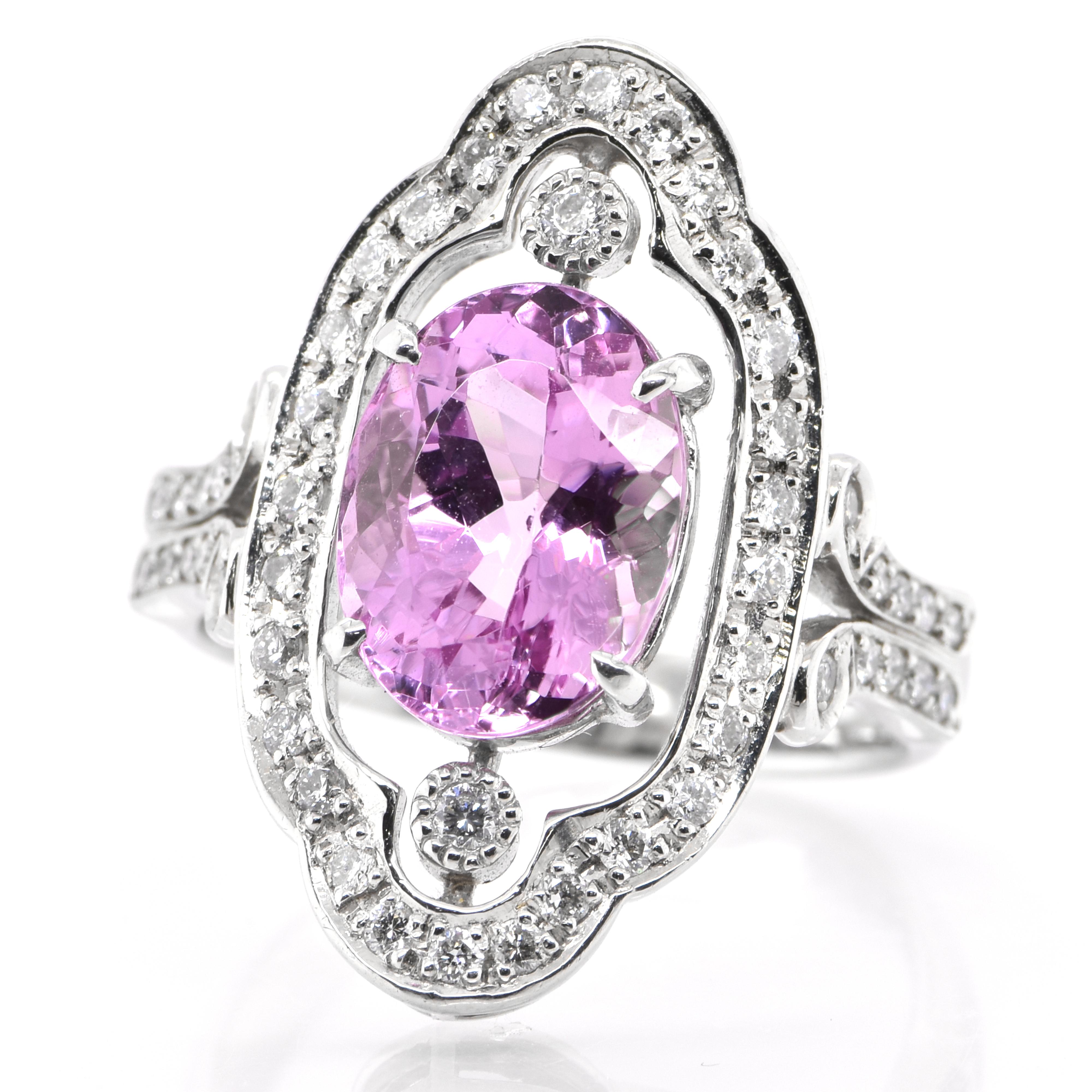A beautiful Ring featuring a Natural 4.15 Carat Pink Topaz and 0.48 carats Diamond Accents set in Platinum. Today Ouro Preto in Brazil is the primary source of Topaz in the world. The ring is made in Japan. Ring size and stamping detailed below.