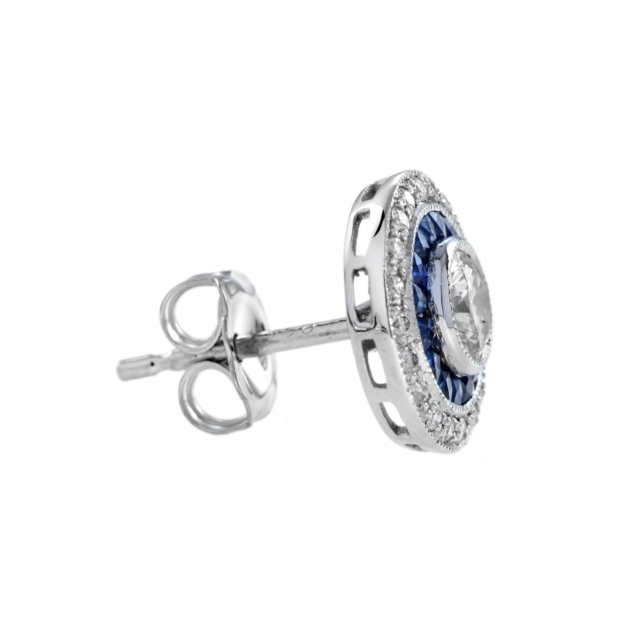 These Art-Deco stud earrings are completely spectacular! The vibrant color stone (you can select Blue Sapphire, Emerald, Ruby) is a specialty cut to surround the excellent round brilliant cut center diamond, which is in a thin bezel with milgrain