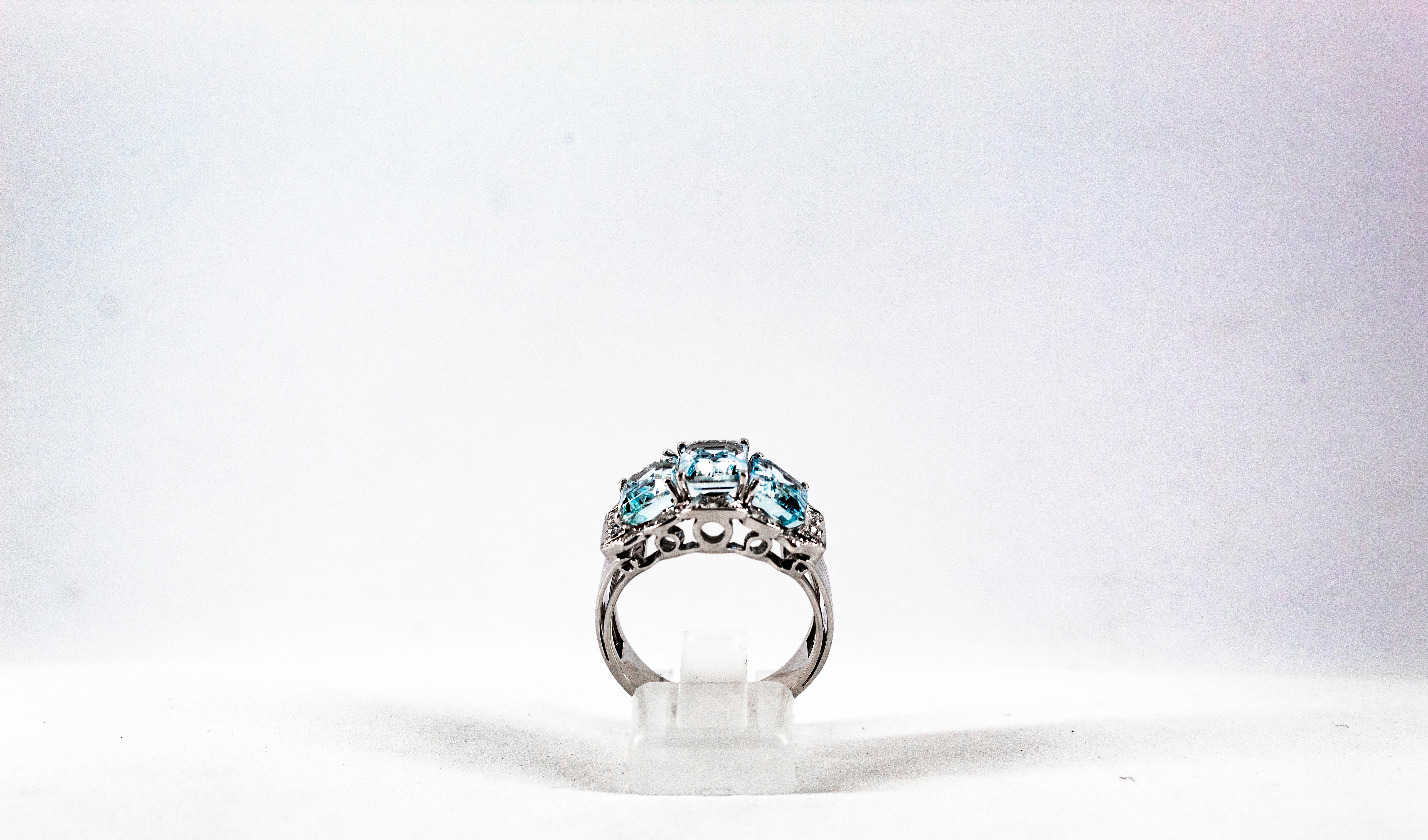 This Ring is made of 14K White Gold.
This Ring has 0.45 Carats of White Brilliant Cut Diamonds.
This Ring has 4.00 Carats of Emerald cut Aquamarine.

Size ITA: 17 USA: 8

We're a workshop so every piece is handmade, customizable and resizable.
