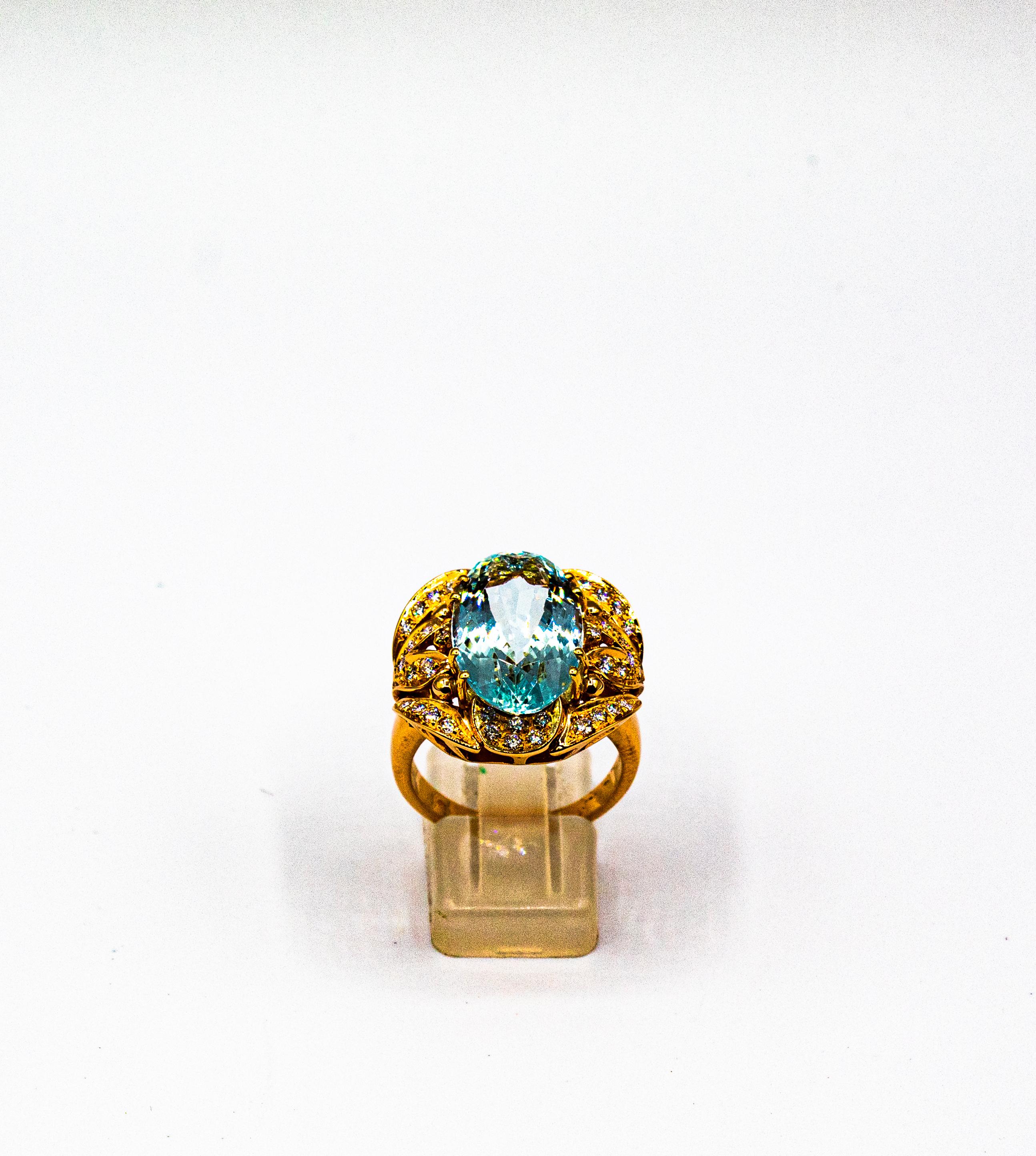 This Ring is made of 14K Yellow Gold.
This Ring has 0.55 Carats of White Brilliant Cut Diamonds.
This Ring has a 8.62 Carats Oval Cut Natural Aquamarine.

Size ITA: 18 USA: 8 1/4

We're a workshop so every piece is handmade, customizable and
