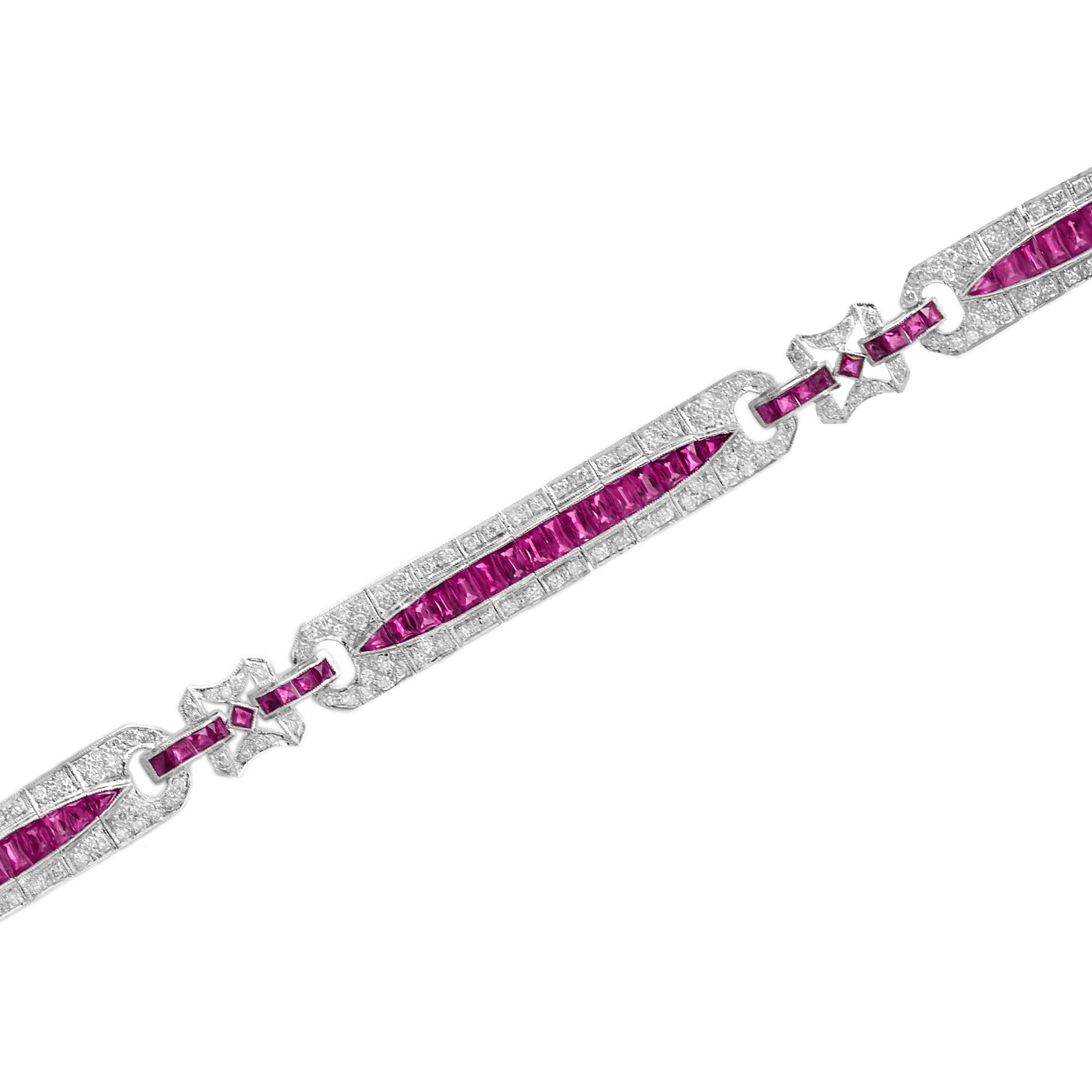 This stunning Art Deco inspired piece is finely crafted from 18k white gold and features an estimated 9.76 carats French cut rubies and 1.50  H-J/SI round brilliant cut diamonds. This wonderful piece is a must-have for any Art Deco