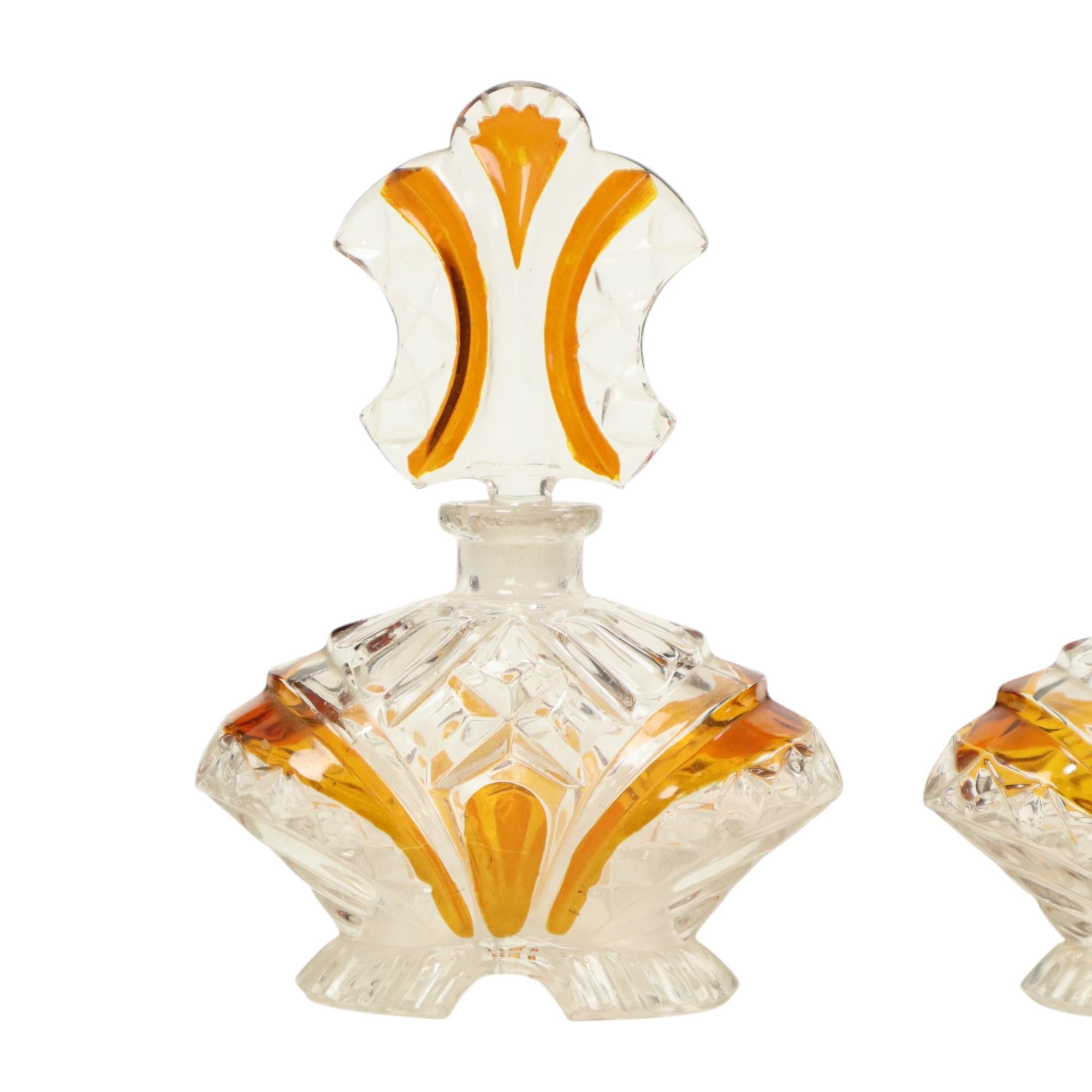 Nice vintage perfume bottles made of amber and transparent lead crystal or lead crystal, completely in art deco style, circa 1960s.

This set includes a perfume bottle with decorative stopper and a perfume diffuser without pump, decorative objects