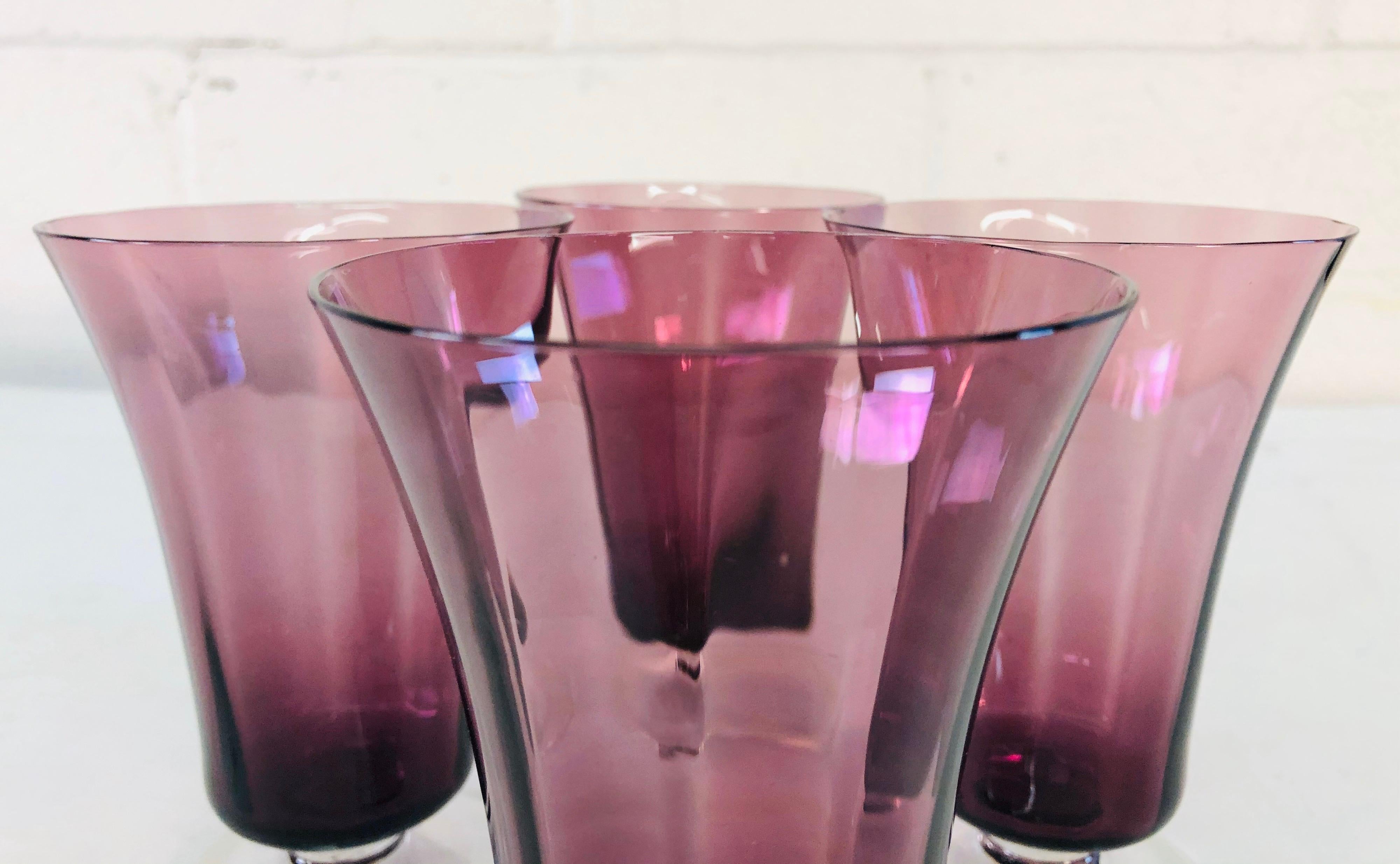 Vintage Art Deco style set of 4 amethyst glass stems with clear bases. The stems have a vertical rib accent. No marks.