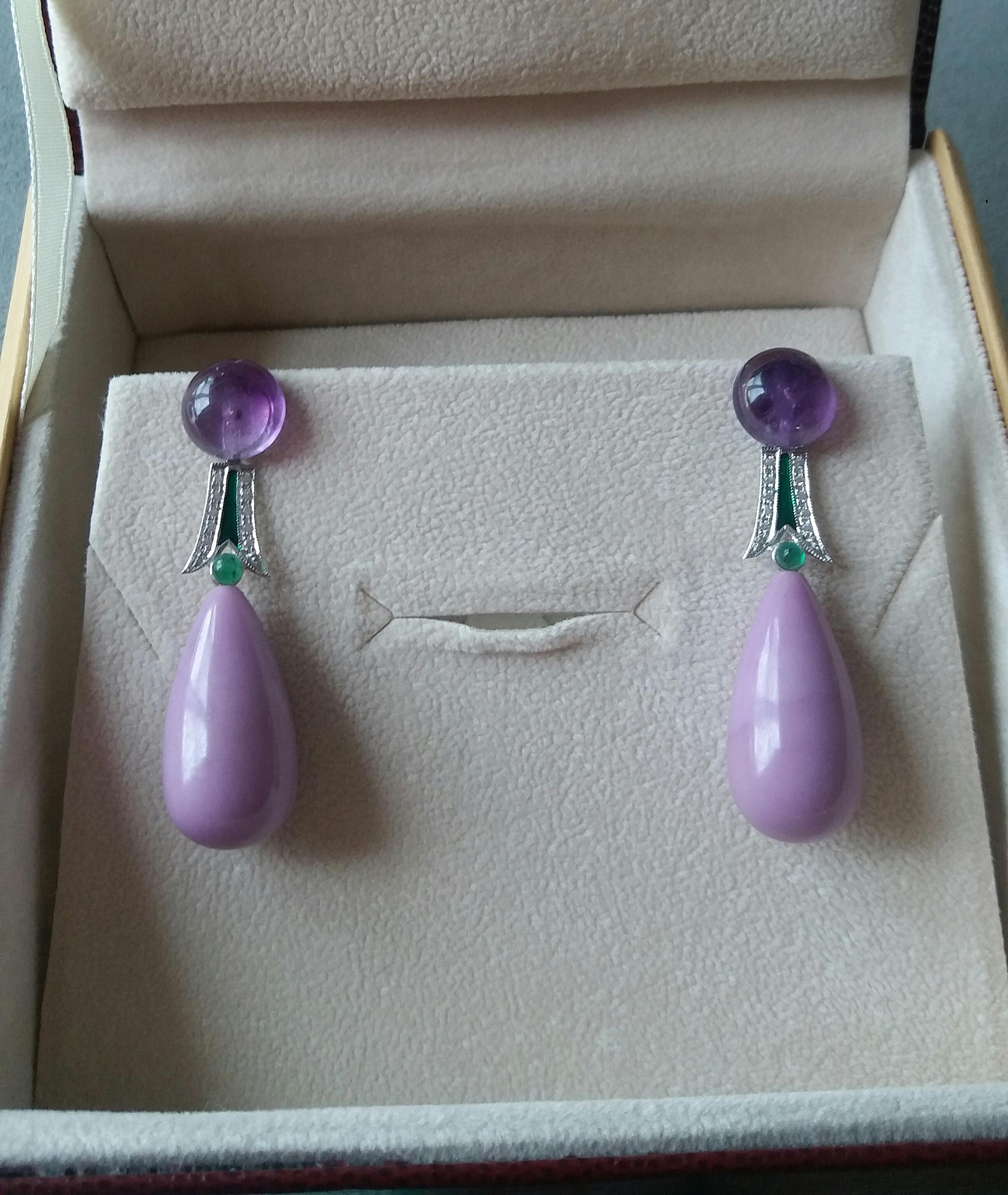 In this pair of earrings 2 round buttons of Amethyst diameter 10mm. support 2 elements in white gold diamonds small emeralds cabochon and green enamel, the bottom is composed of 2  Phosphosiderite round drops size 24 x 12 mm.
In 1978 our workshop