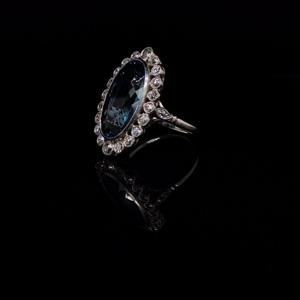An Art Deco style aquamarine and diamond oval platinum cluster engagement ring.

A really beautiful oval aquamarine and diamond cluster ring set with a rich deep blue centre stone perfecting framed by twenty Old European cut diamonds each in its