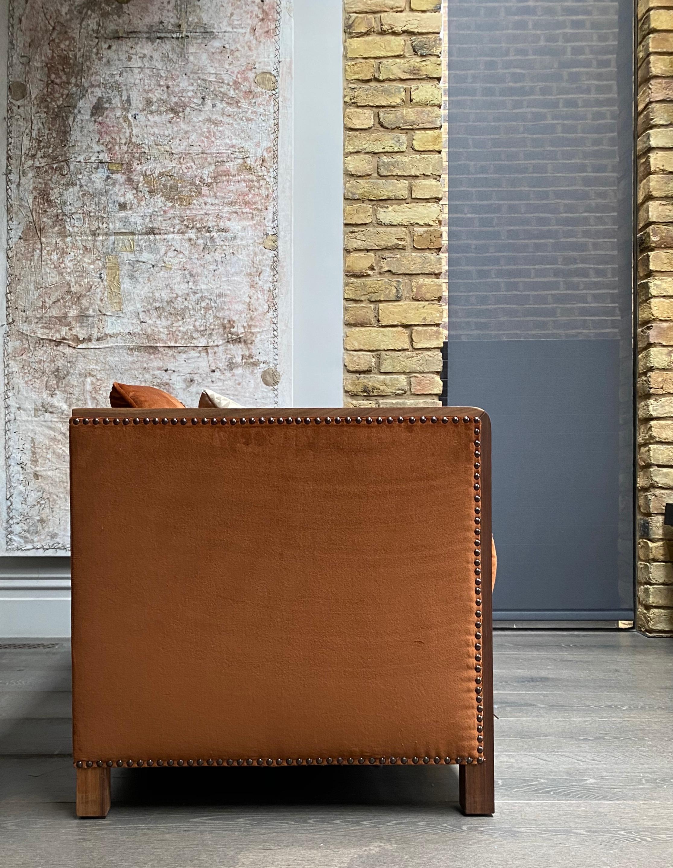 Utterly lounge worthy, the Bacco armchair design is a contemporary remodel of the iconic boxy chair.

Showing opulence with a Hollywood Regency feel, the glamorous Bacco armchair is upholstered with natural wood finishes, 6 meters of the most divine