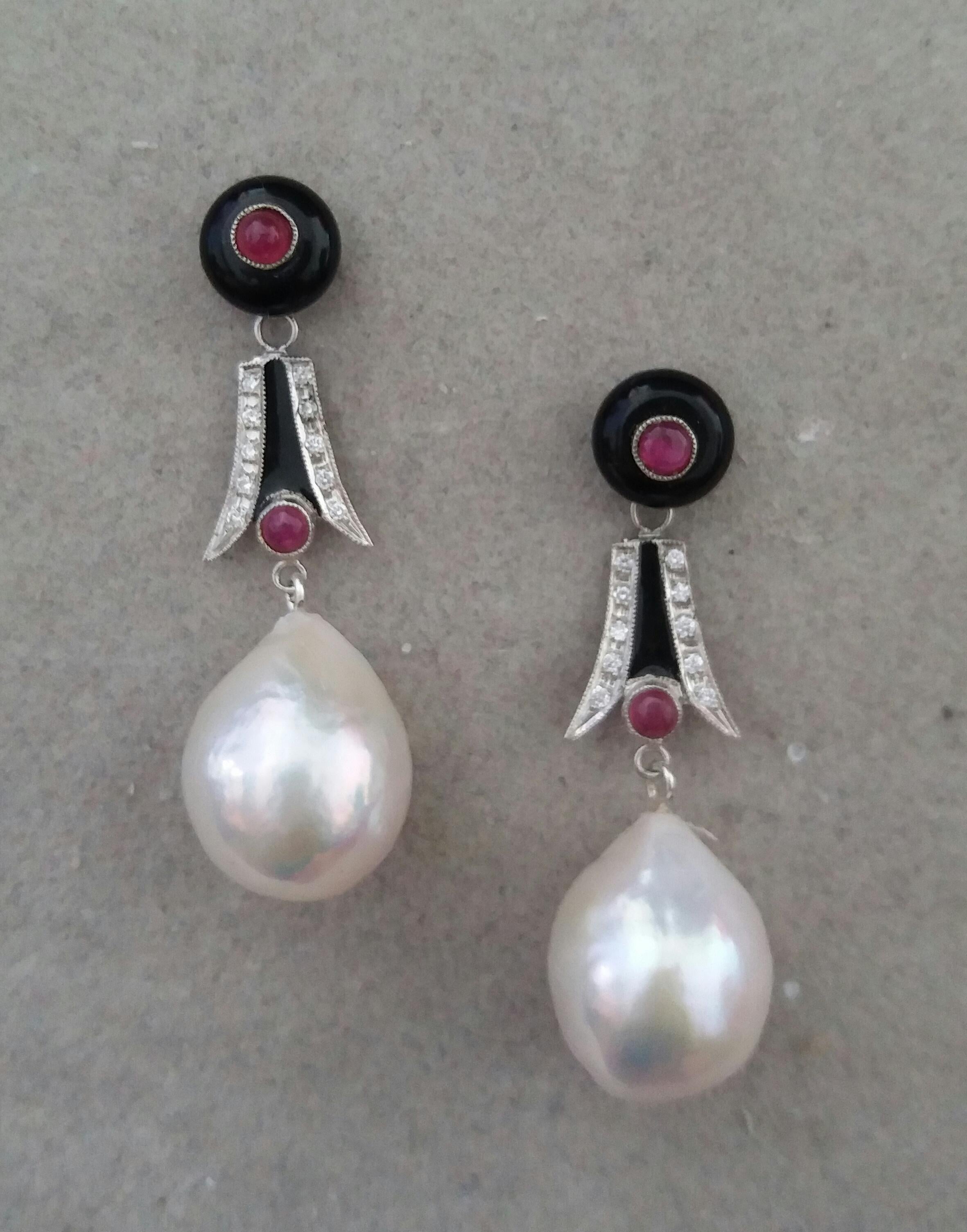 In these Classic Art Deco Style Earrings we have 2 round black onyx buttons with small round rubies in the center,middle parts are composed of 2 white gold elements set with small round rubies cabs,20 small round full cut diamonds,black enamel, 2