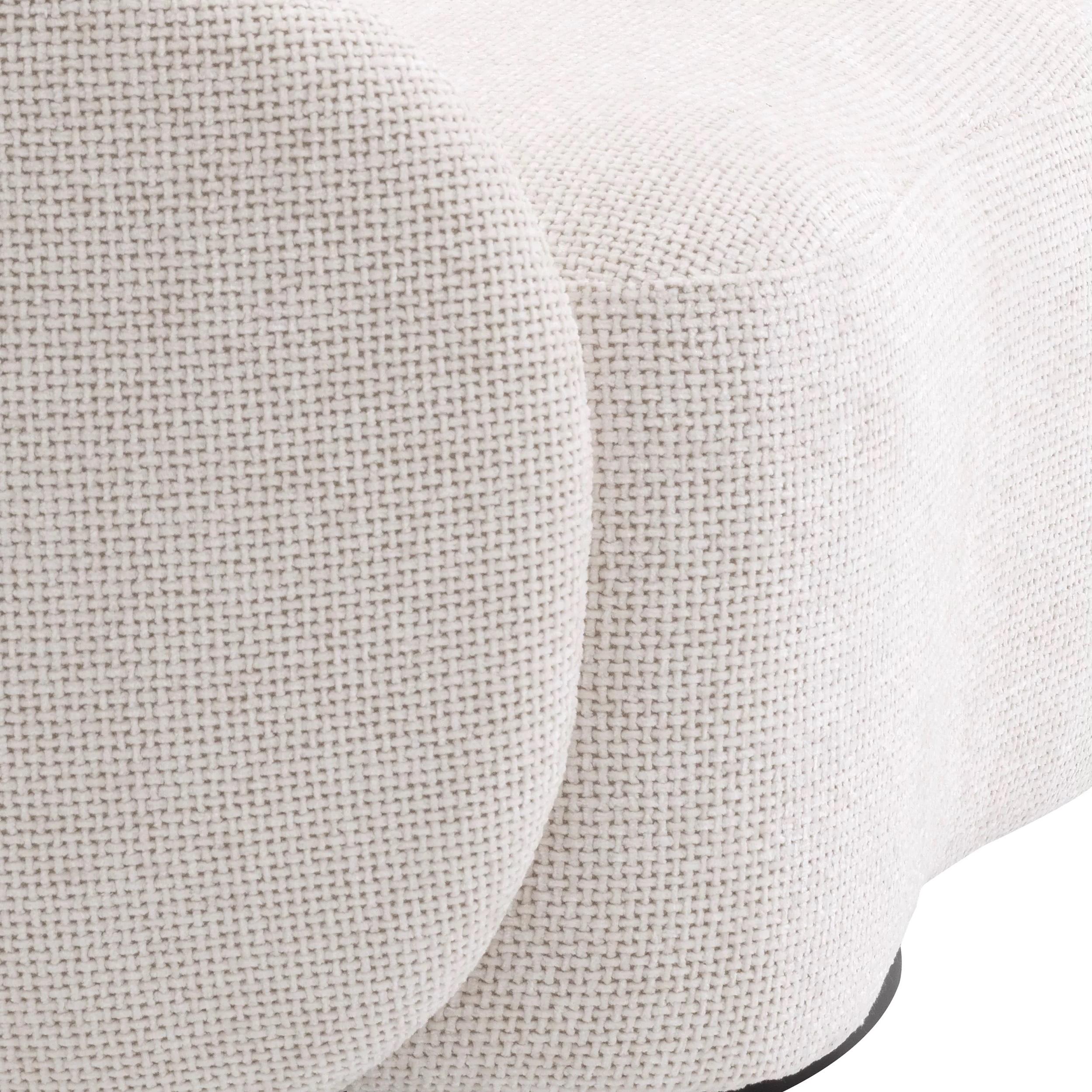 Welcoming and curved swivel armchair in an Art Deco Style, soft beige bouclé fabric with brass finishes base.
