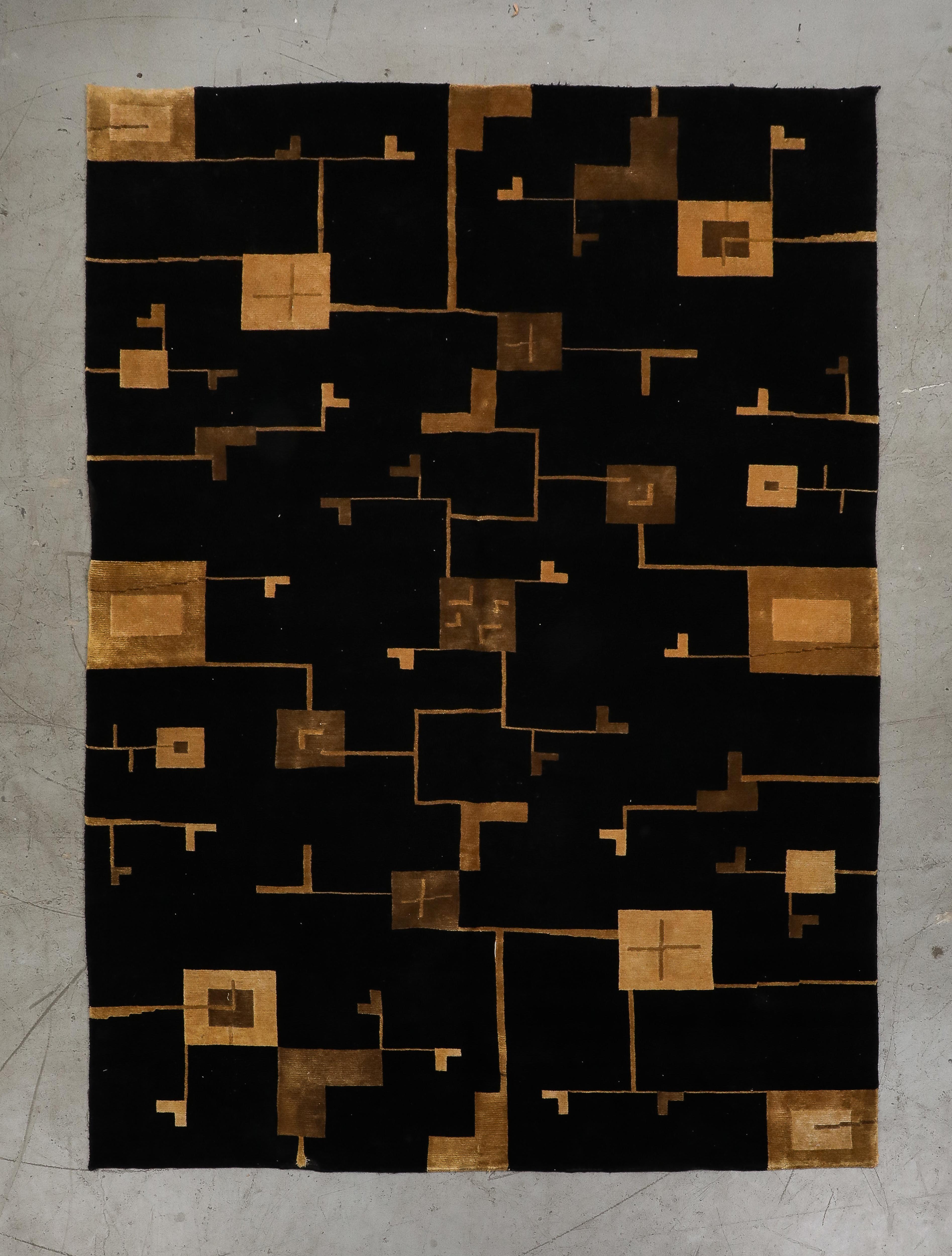 Black and gold/beige Art Deco style hand-woven wool rug. Dimenstions: 6' W x 8' 7