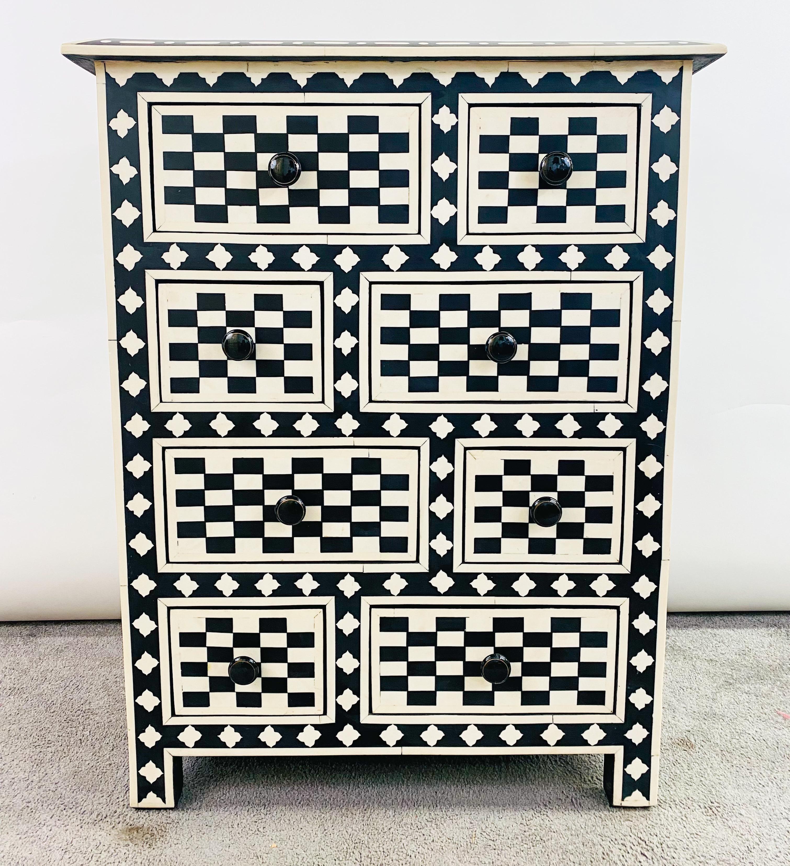 A delightful Art Deco style dresser, commode or chest featuring checkers motifs in black and white. The beautiful chest or dresser offers 8 drawers in total in two different sizes creating a stylish look. The sturdy chest or dresser is hand made of