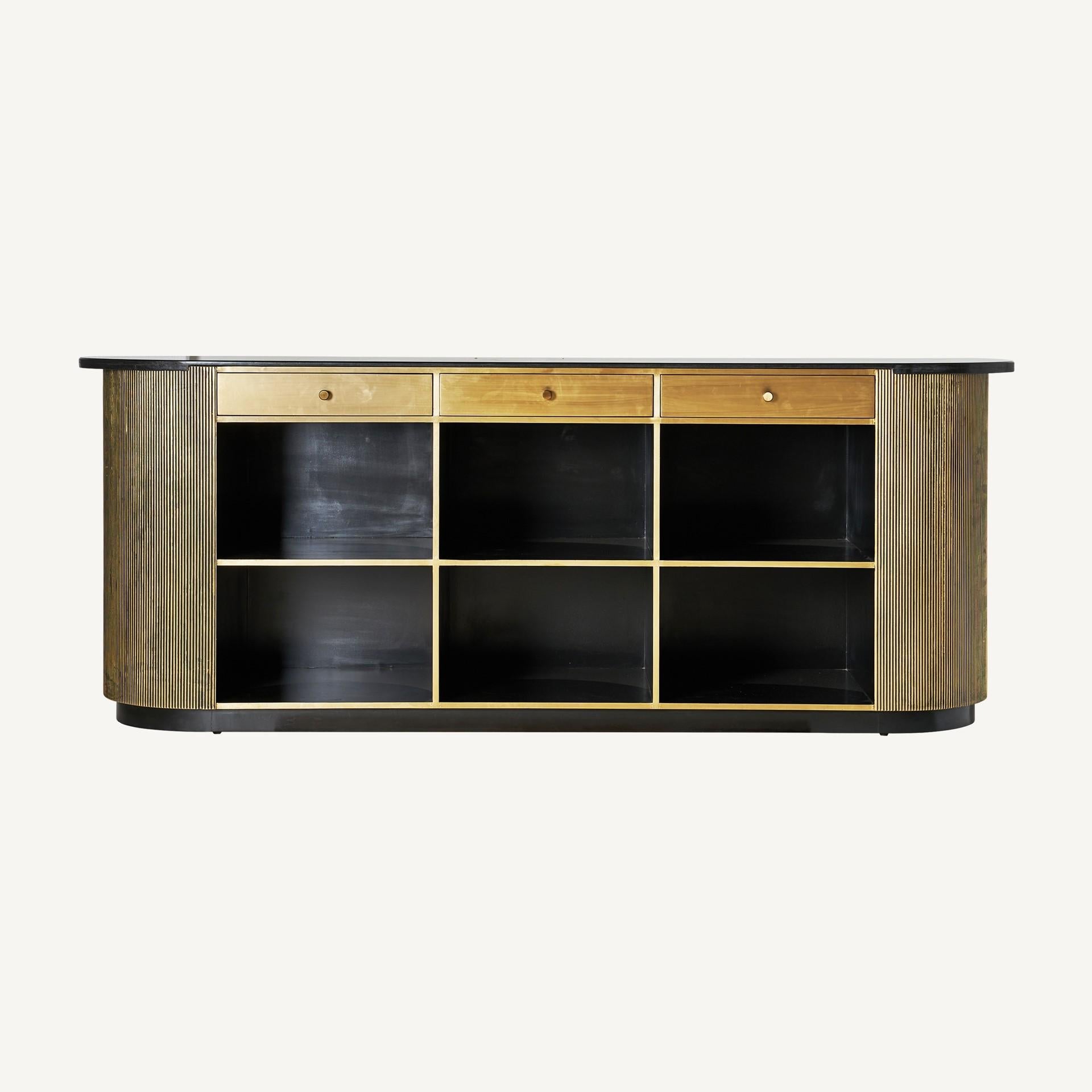 Oval and black bevelled stone tray, curved and rounded lines bar or counter table sparkling and sophisticated with black lacquered wooden structure with brass finishes, opening shelves spaces on the other side. Just amazing!