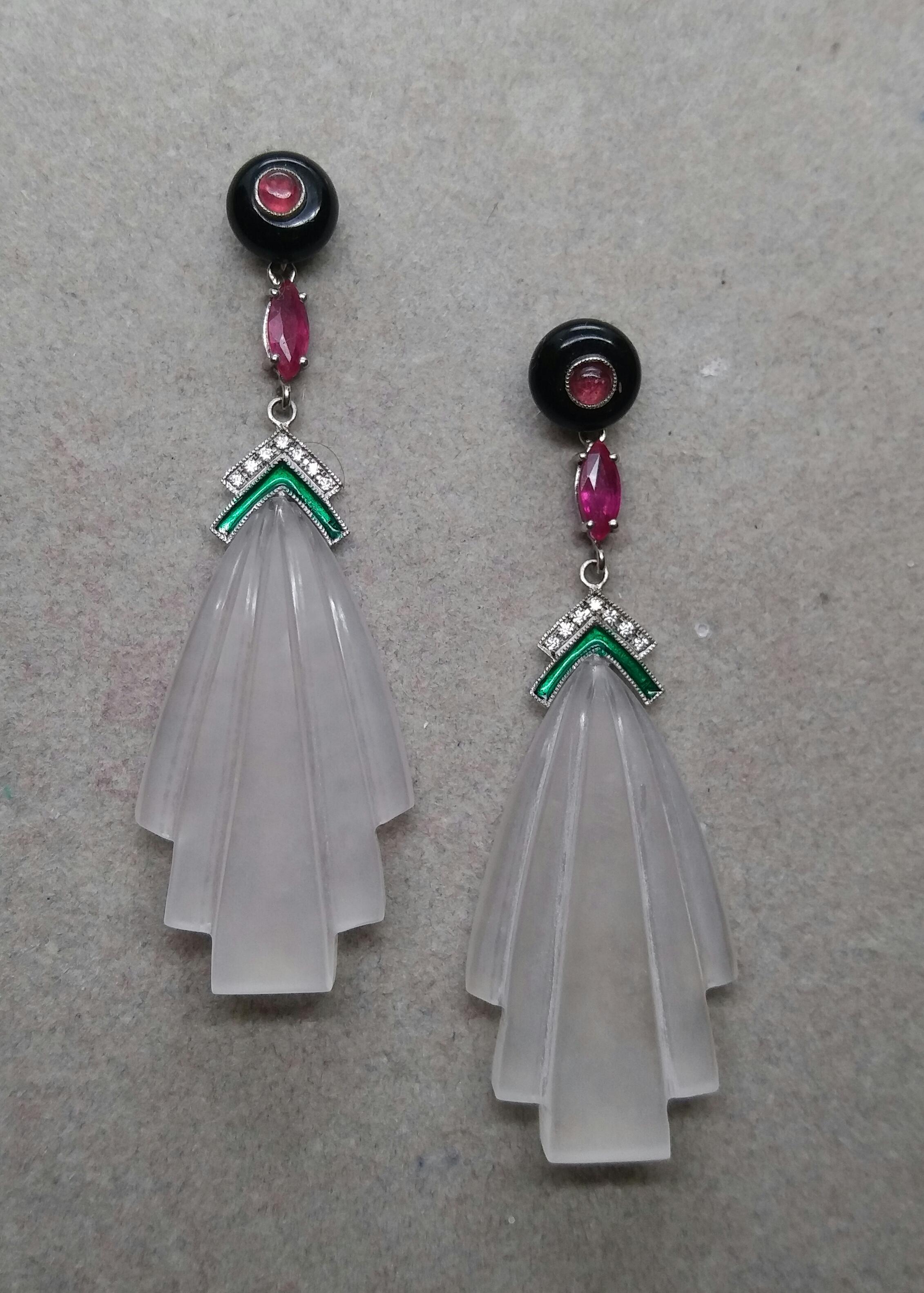 2 round Black Onyx buttons with small round cabs ruby in the center  are on the top part, middle parts with 2 marquise cut Rubies, white gold ,14 round full cut diamonds,Green Enamel, in the bottom parts we have 2   engraved   Rock Crystal elements