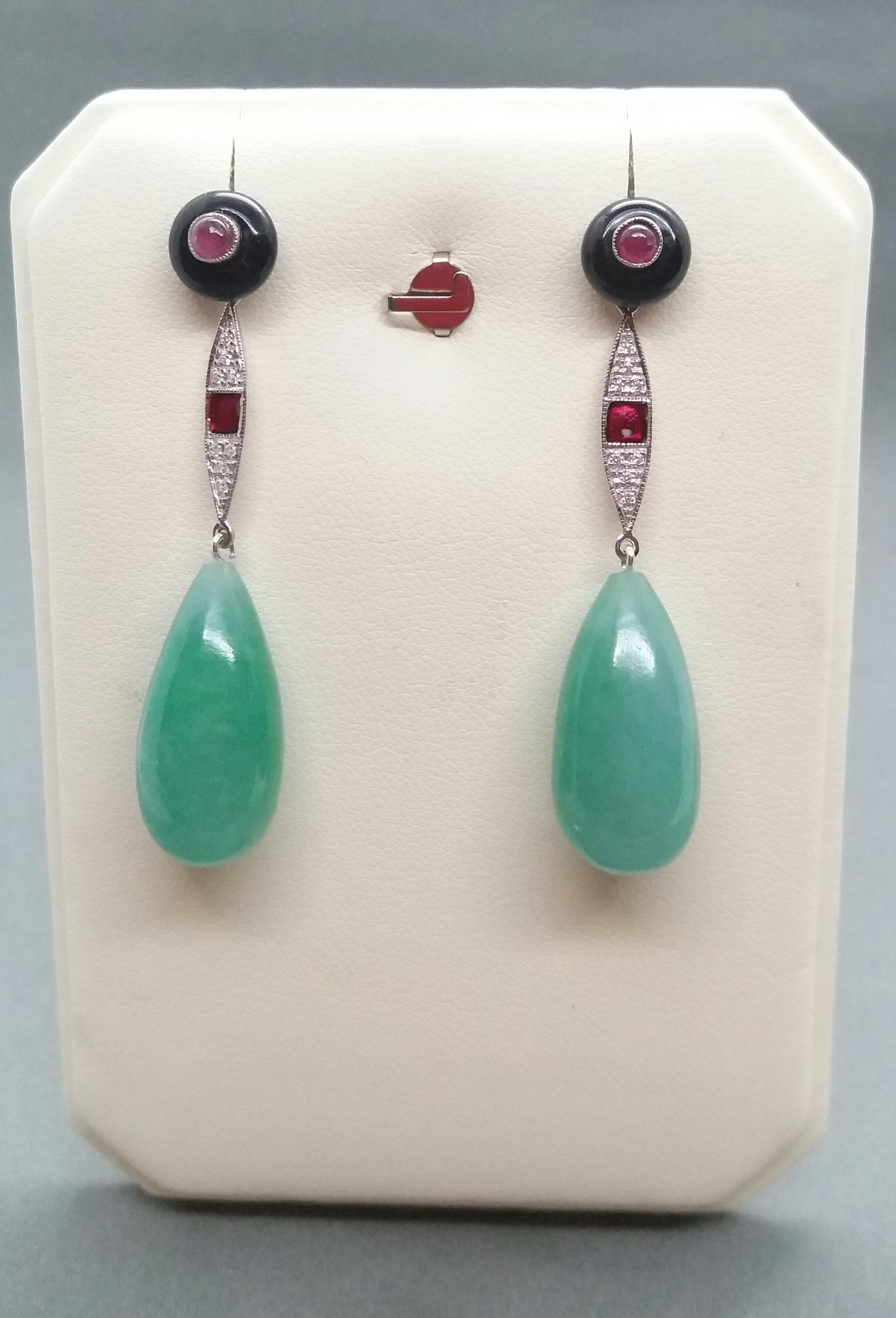 In these classic totally handmade Art Deco Style earrings we have 2 round black onix buttons with small round Rubies in the center,middle parts in white gold,16 small round full cut diamonds,red enamel,2 Burma Jade round drops size 23x 12 mm.

In