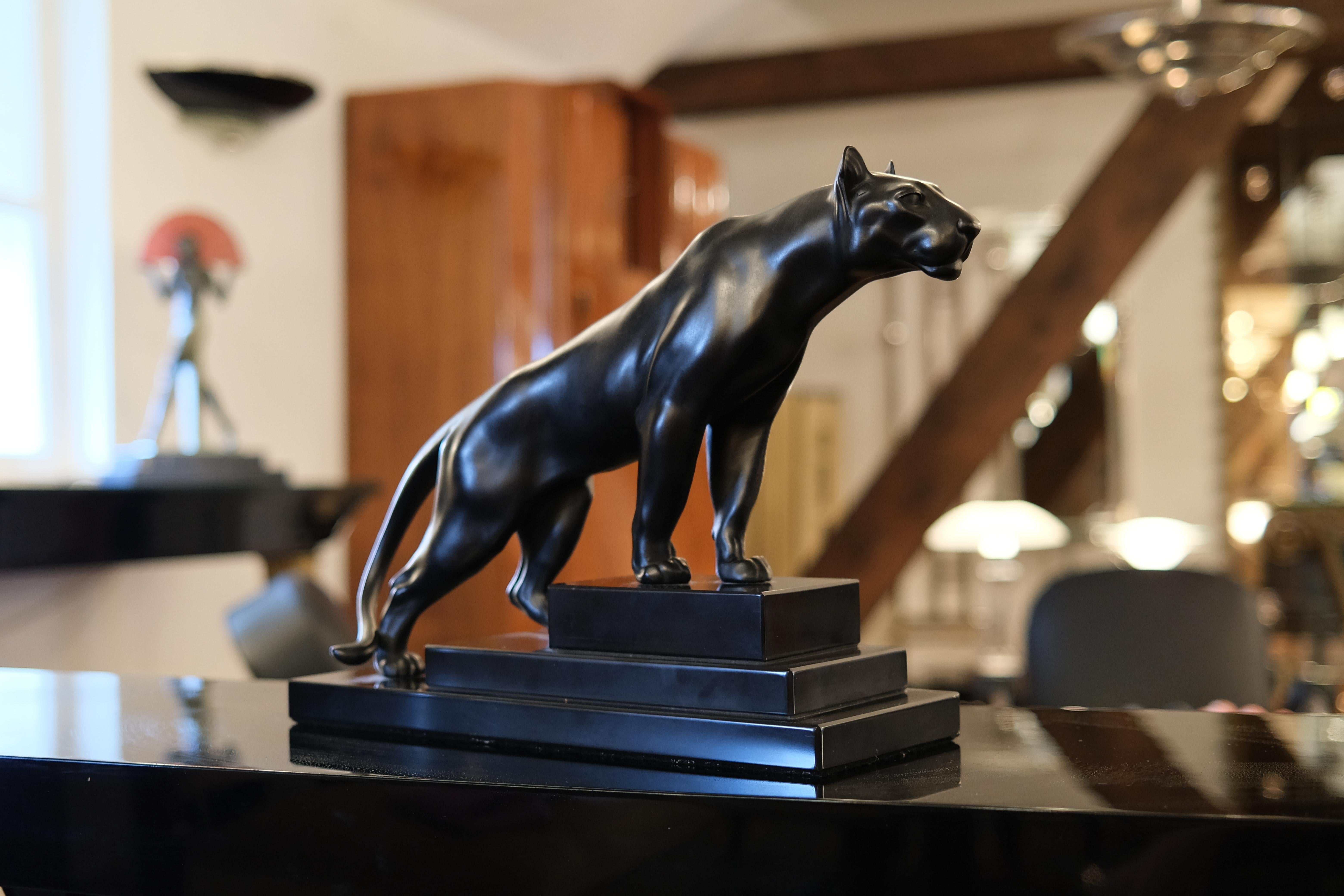 Panther sculpture named “Jungle” on a stepped marble base. 
Original “Max Le Verrier”, signed 
Designed in France during the roaring 1920s by “Max Le Verrier” (1891-1973) 
Art Deco style, France 

Sculpture made in “Régule” (spelter) 
Socle in black