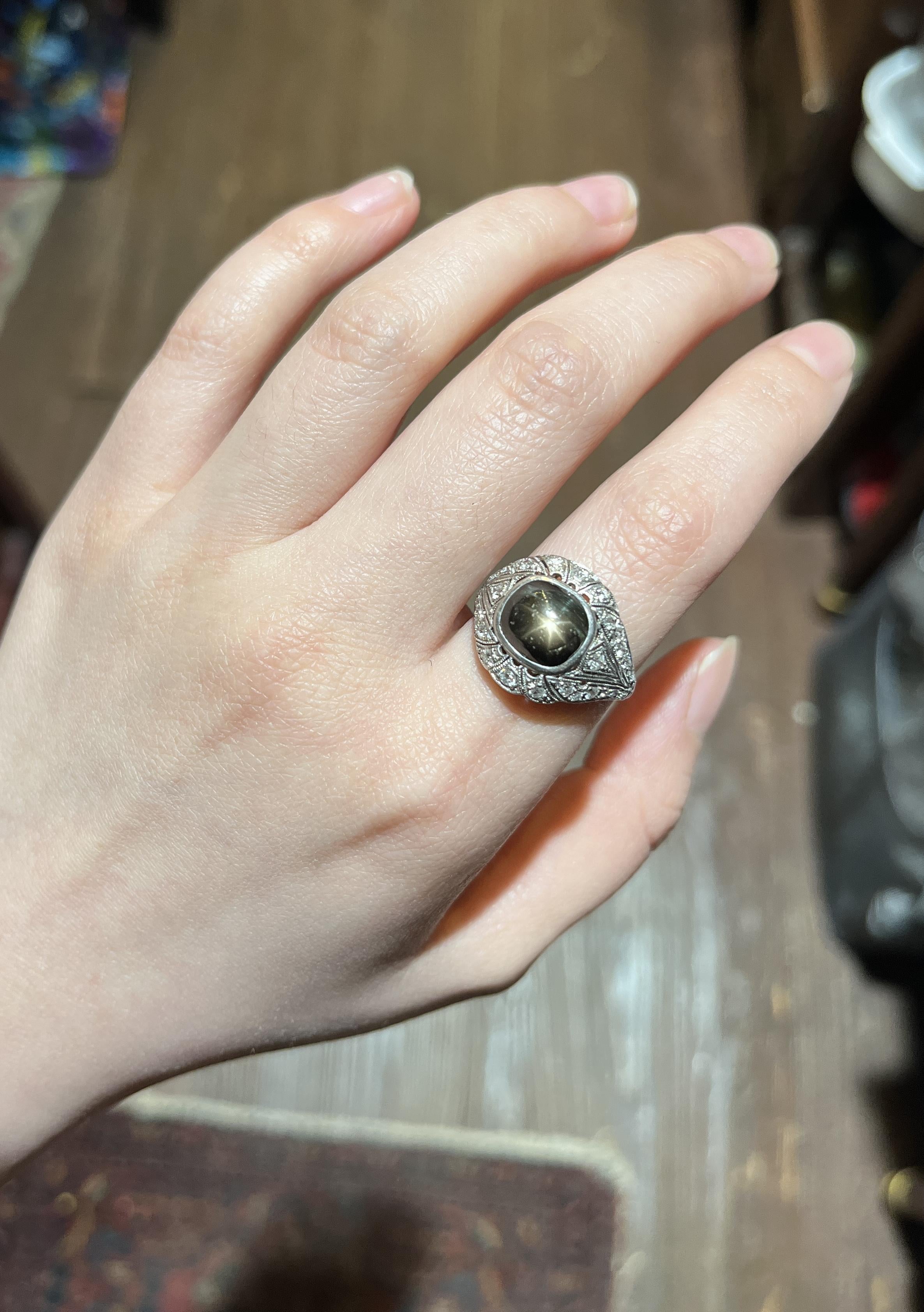 Art Deco Style Black Star Sapphire Diamond Platinum & 10K Ring
The ring was originally crafted in platinum as the table tested positively for Platinum with the bottom of the ring shank tests for 10K Gold likely due to resizing sometime during